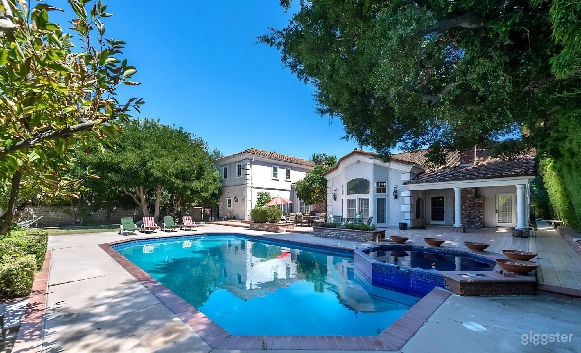 OUTDOOR POOL | GRAND TRADITIONAL ESTATE Photo 1