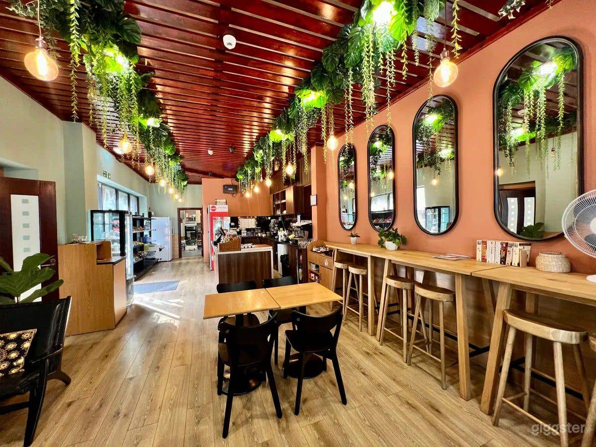 Cafe area with kitchen, reception and additional seating