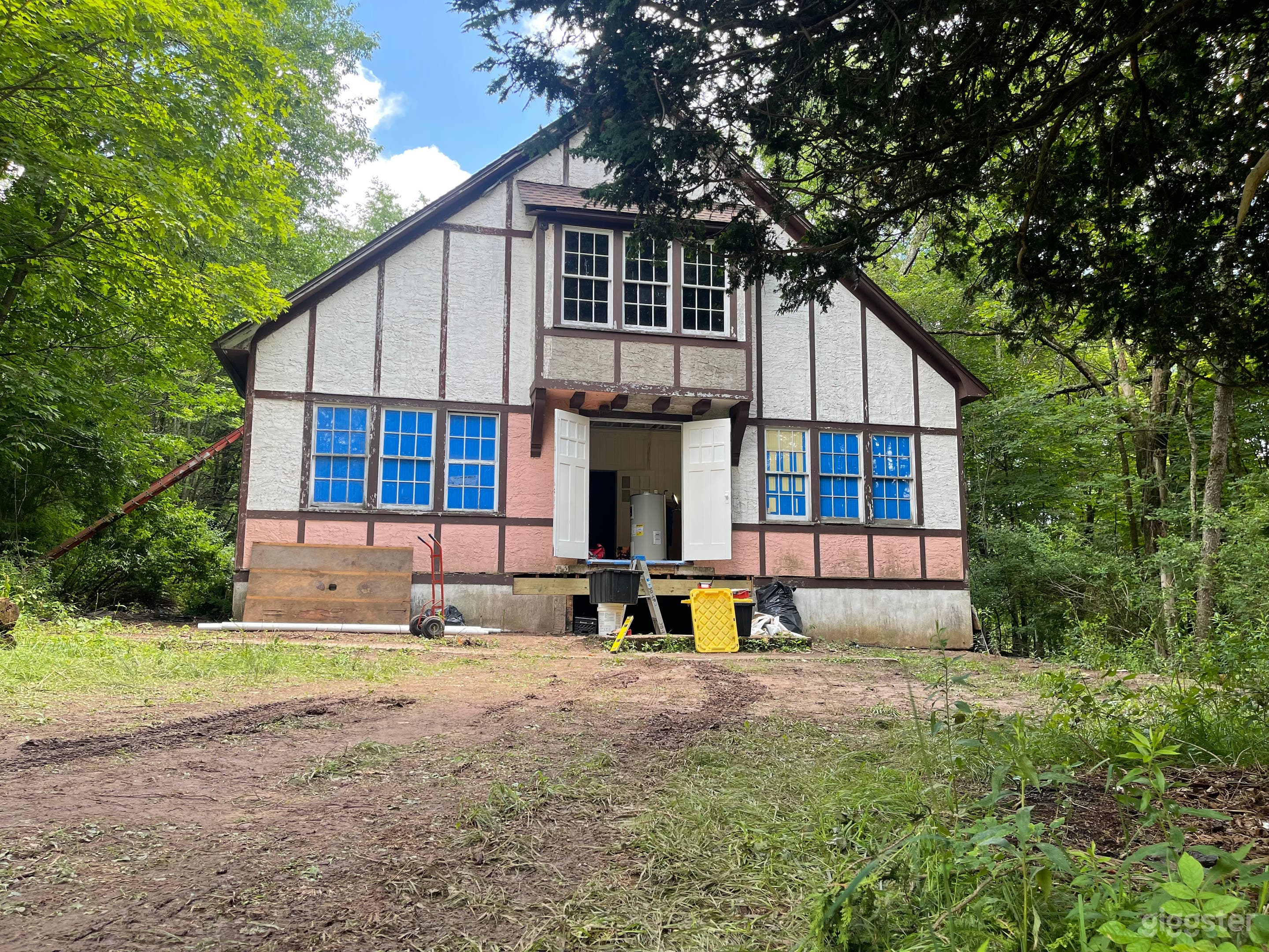 Front (no blue masking in windows now, simple wood stair in front).