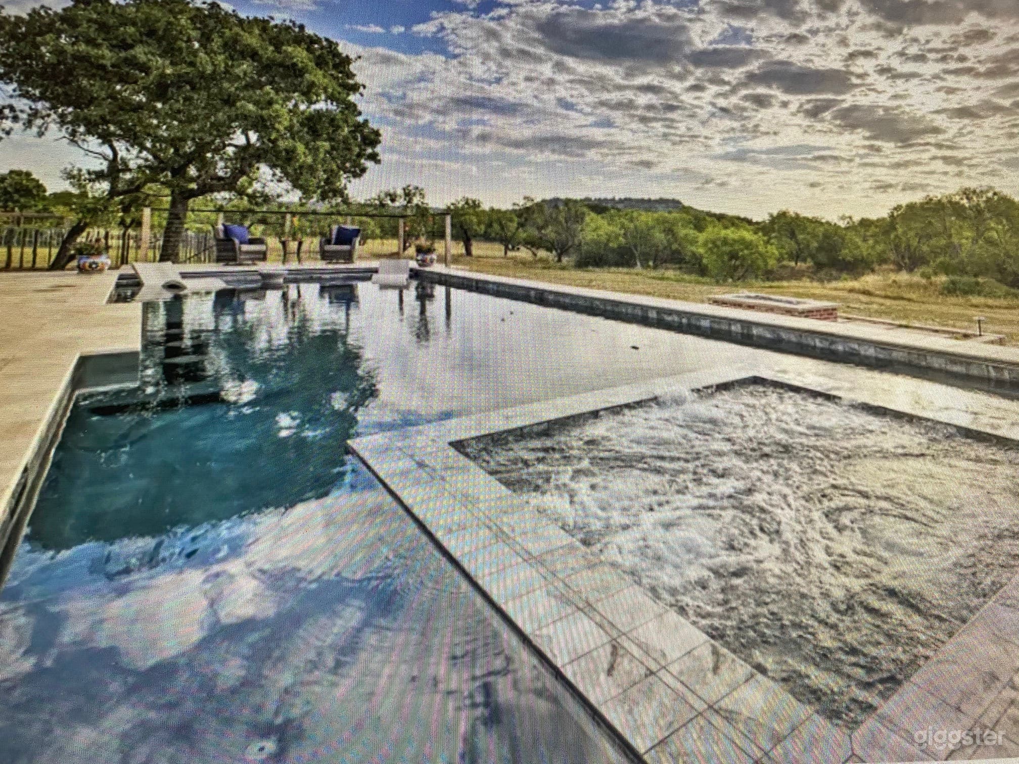 Hot Tub and Tanning Deck on South End of Pool
