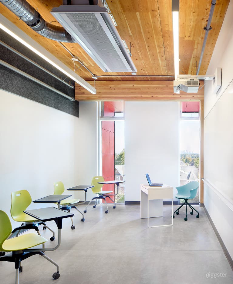  Versatile Learning Space: A well-equipped room with chairs, ideal for classes, workshops, and meetings. 