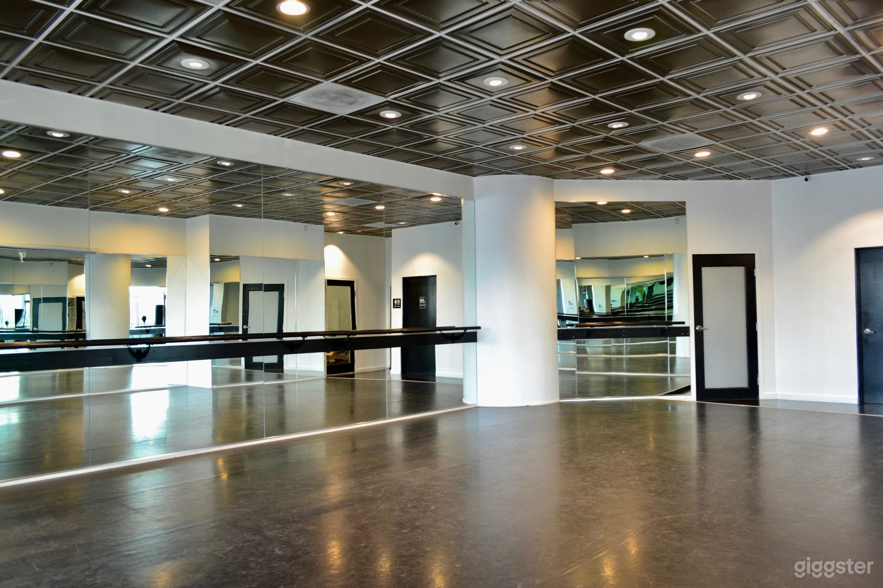 Dance studio mirrored wall with mounted ballet barre