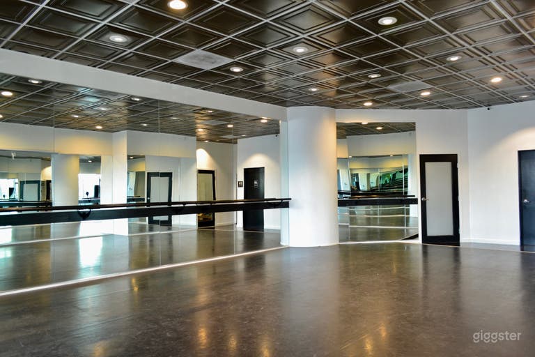  Dance studio mirrored wall with mounted ballet barre 