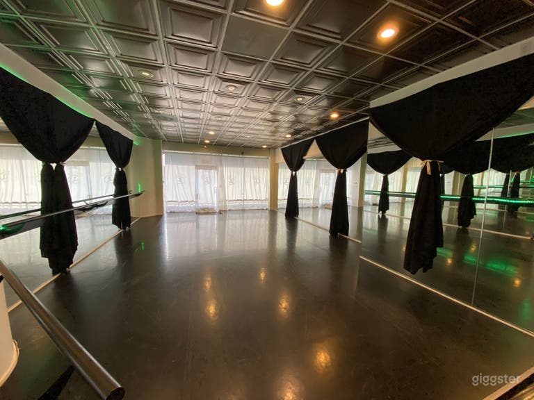  Dance studio with white curtains over front windows. When open offers beautiful view above balcony  