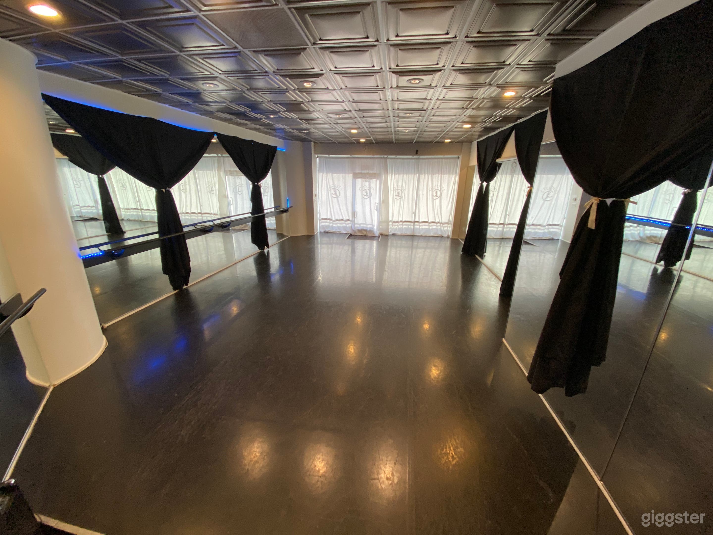 Dance studio with night vibes curtains to block out mirrors for performance or black box theater space 