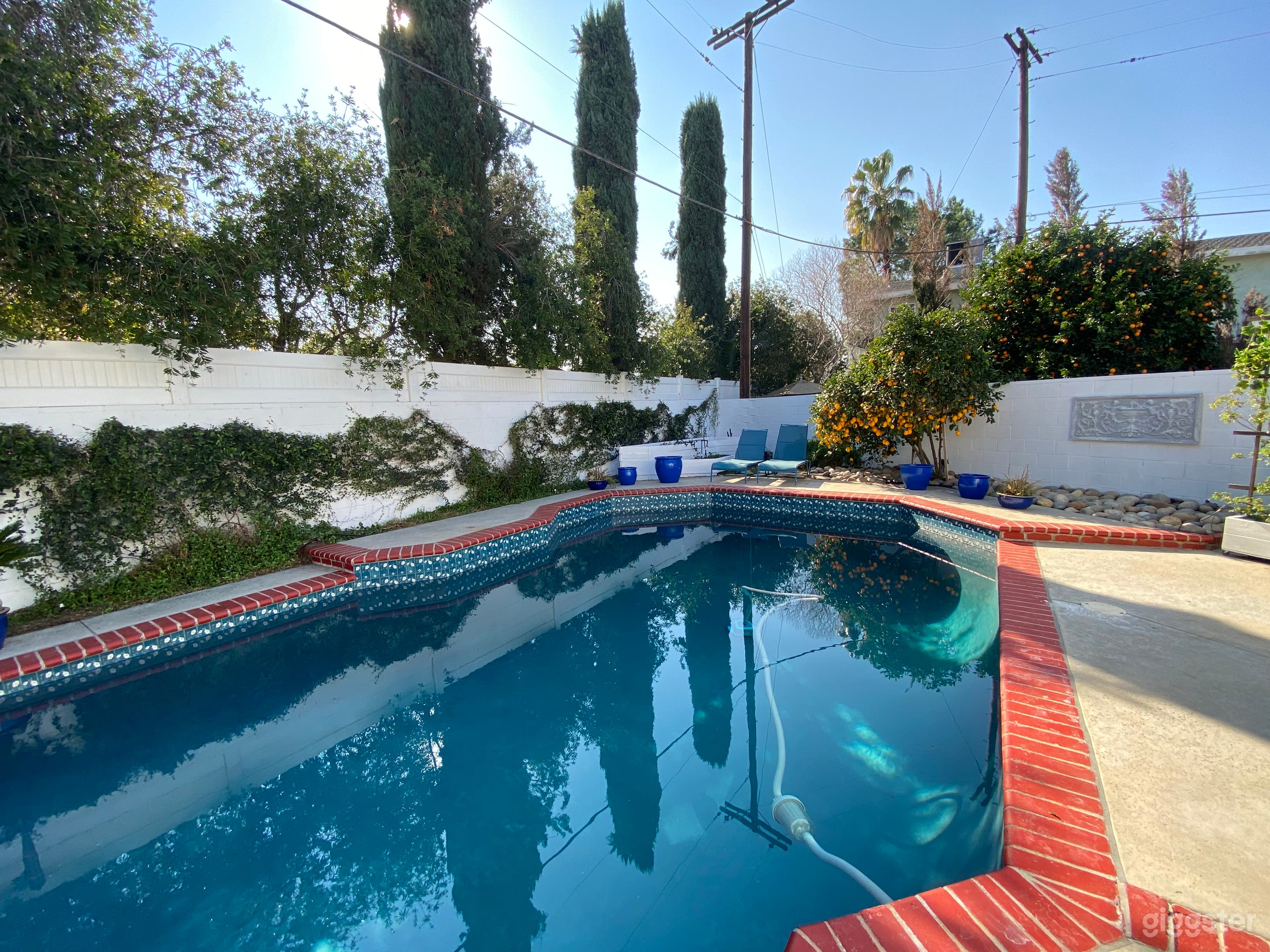 Mediterranean style pool and backyard Photo 2
