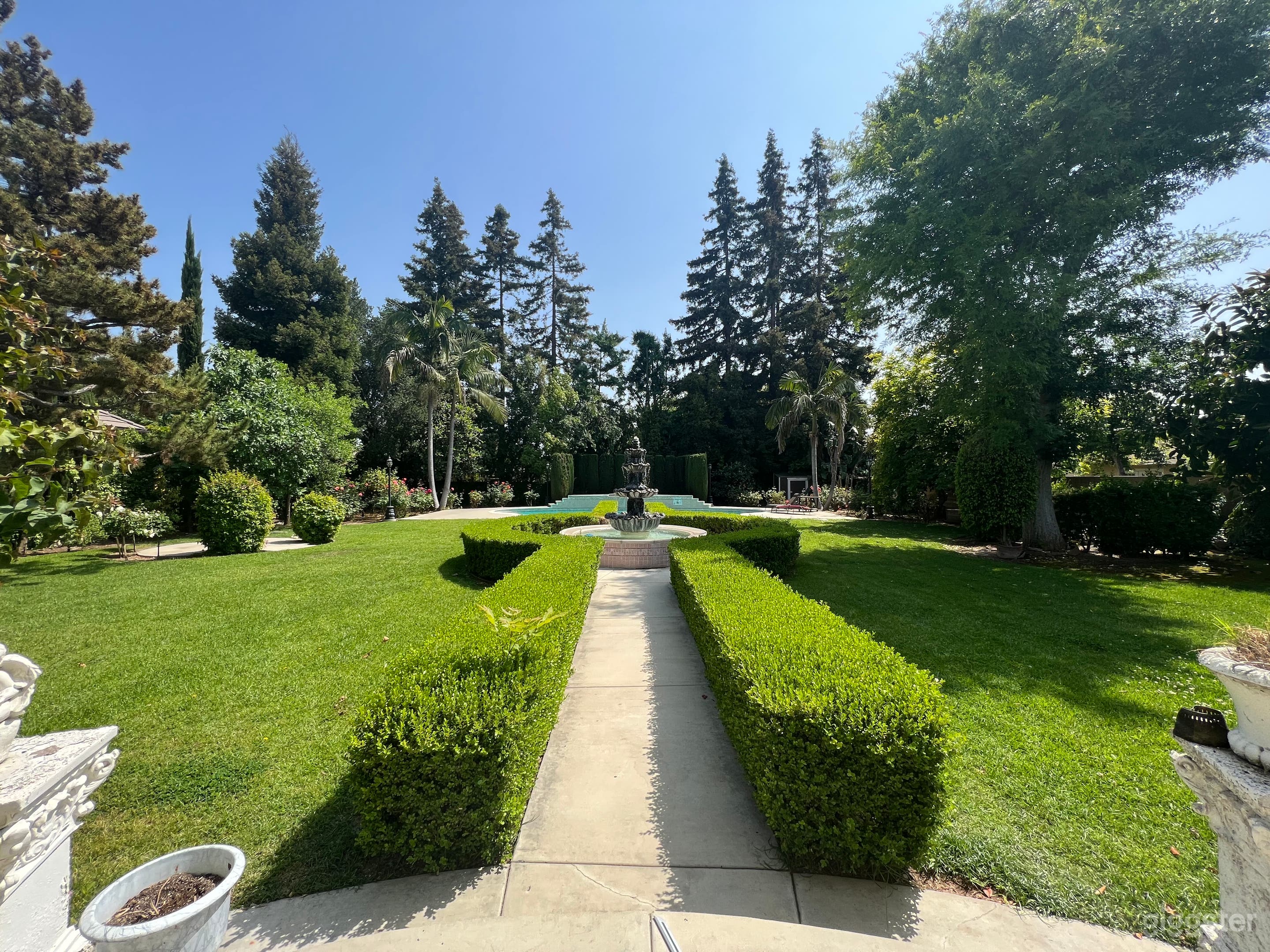 Extravagant Pool Garden with a Water Fountain  Photo 4