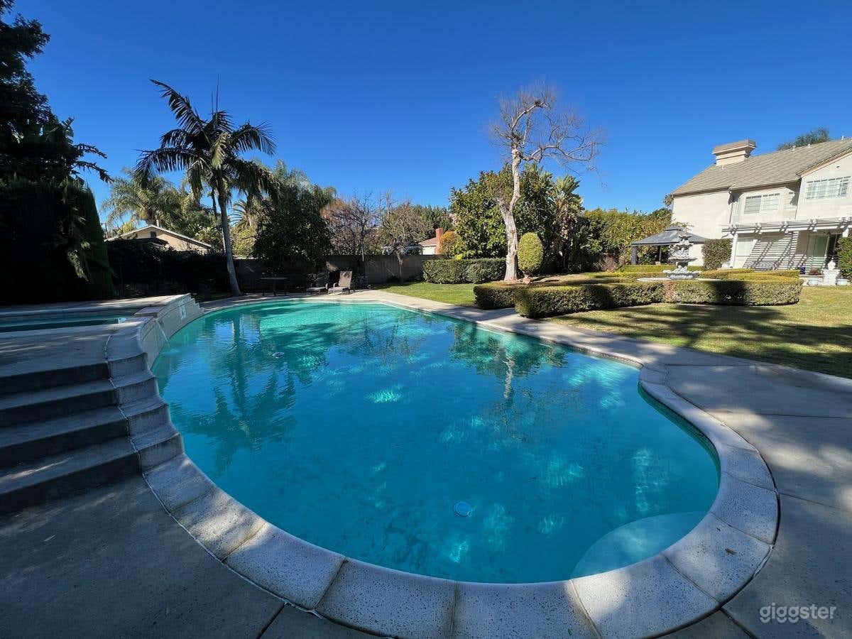 Extravagant Pool Garden with a Water Fountain  Photo 1