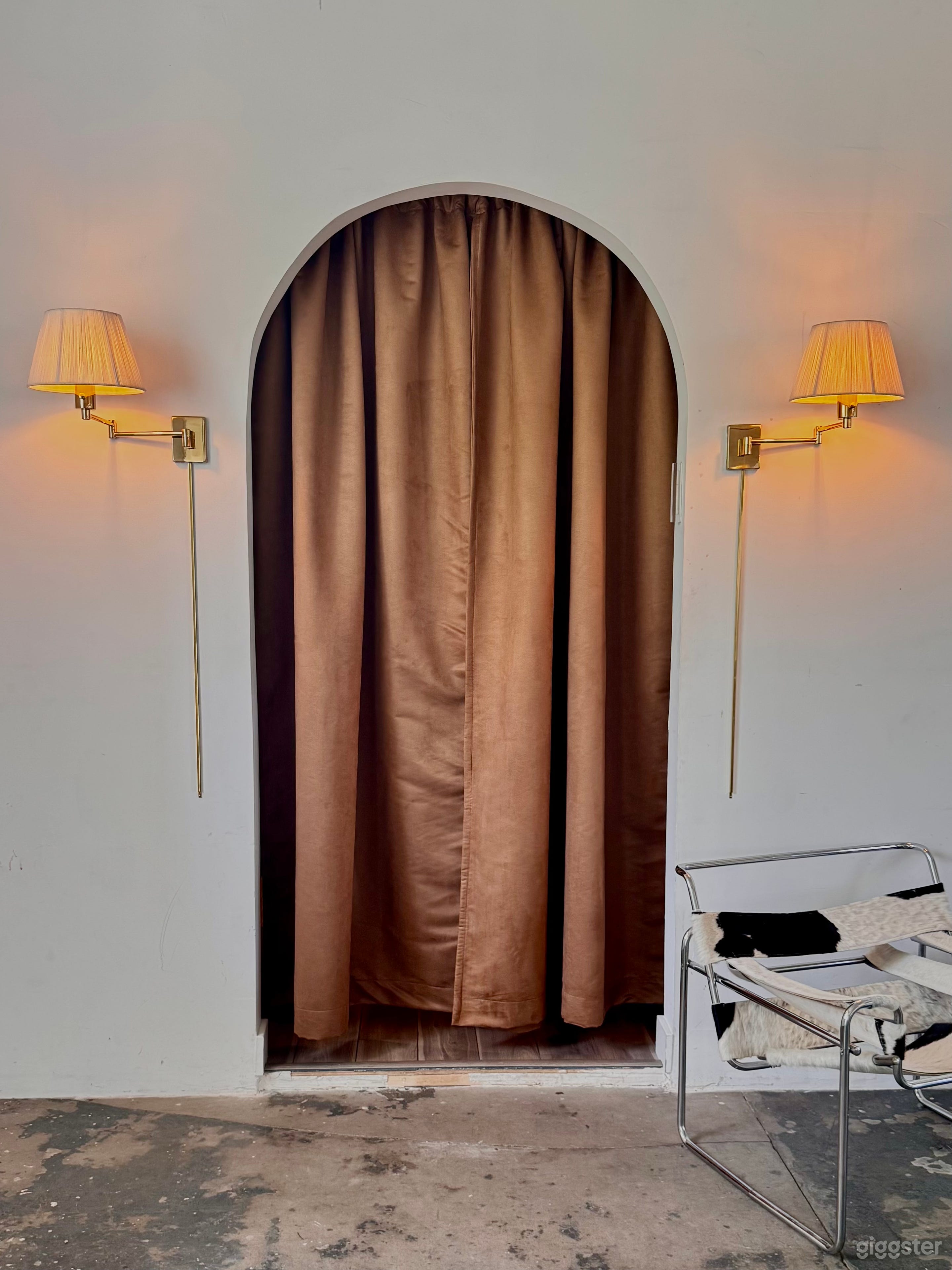 PODCAST ROOM LOCATED BEHIND THE CURTAIN