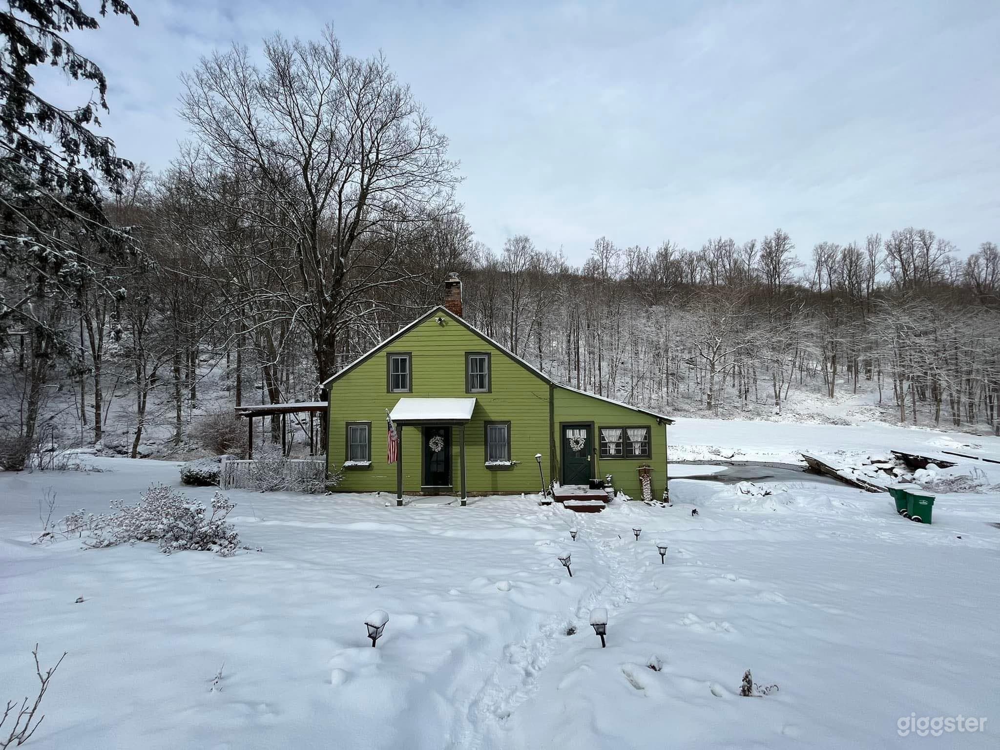 Front of house from road. 
Winter. 
