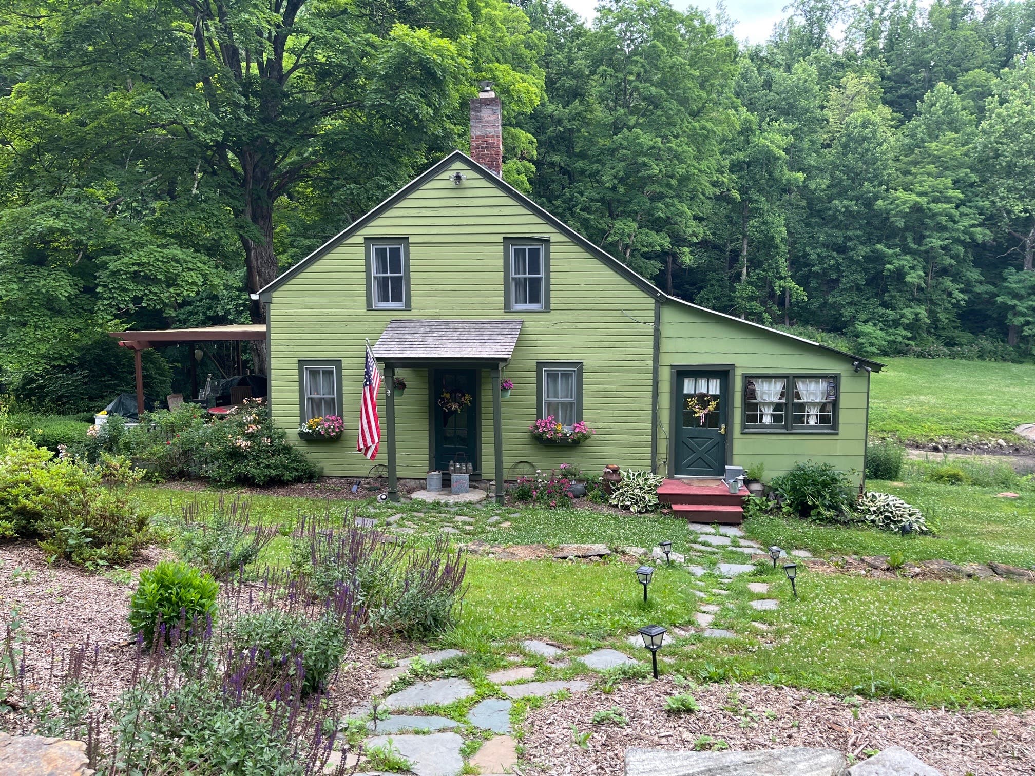 Front of house from road. Summer. 