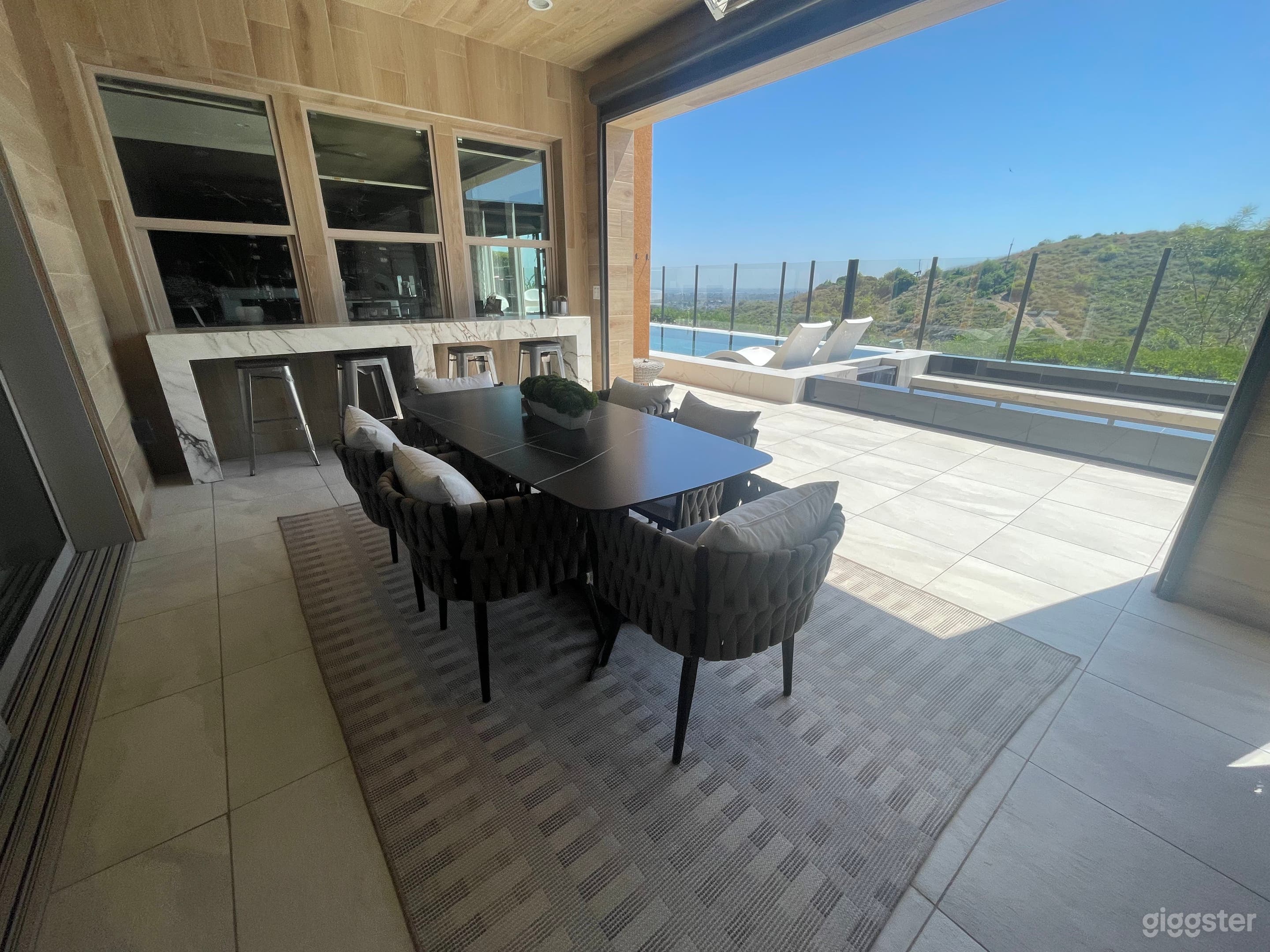 outdoor dining room area with heaters above 