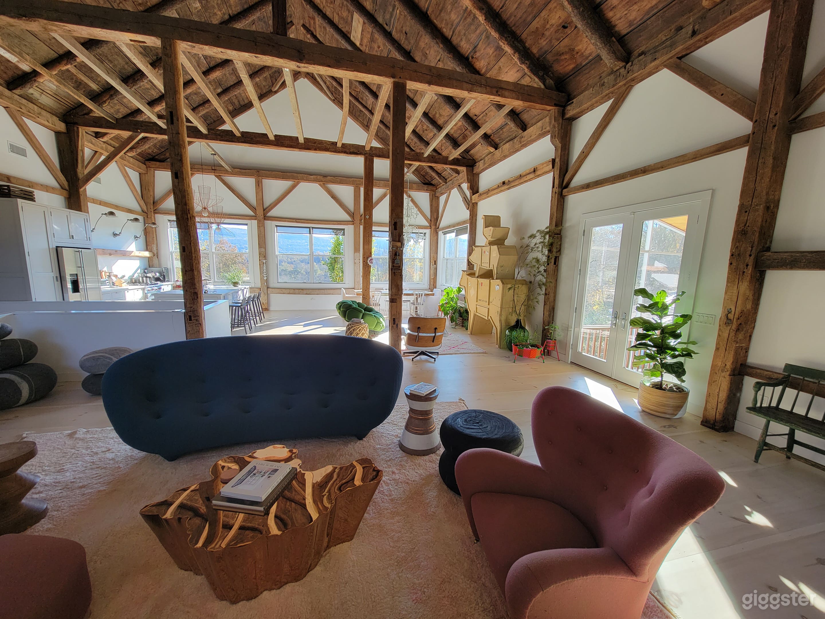 Living room with stunning views of the Taconic Range and cozy stone fire place