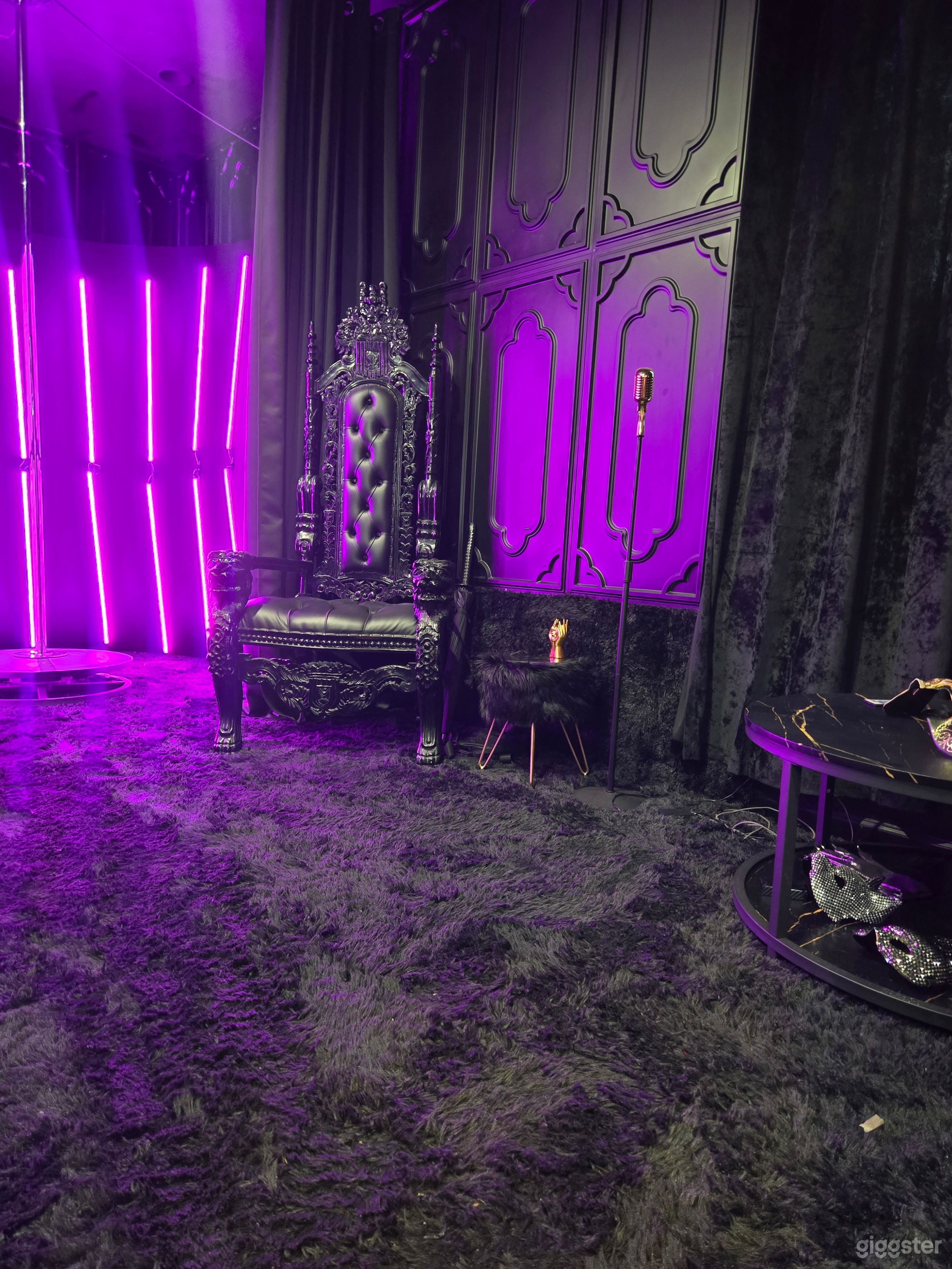 main area with curtains for a complete black out experience. LED photo backdrop that can change to any color