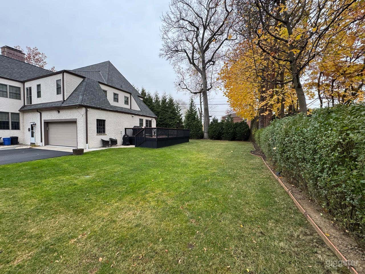 Backyard Haven Behind a Traditional Tudor Home Photo 2