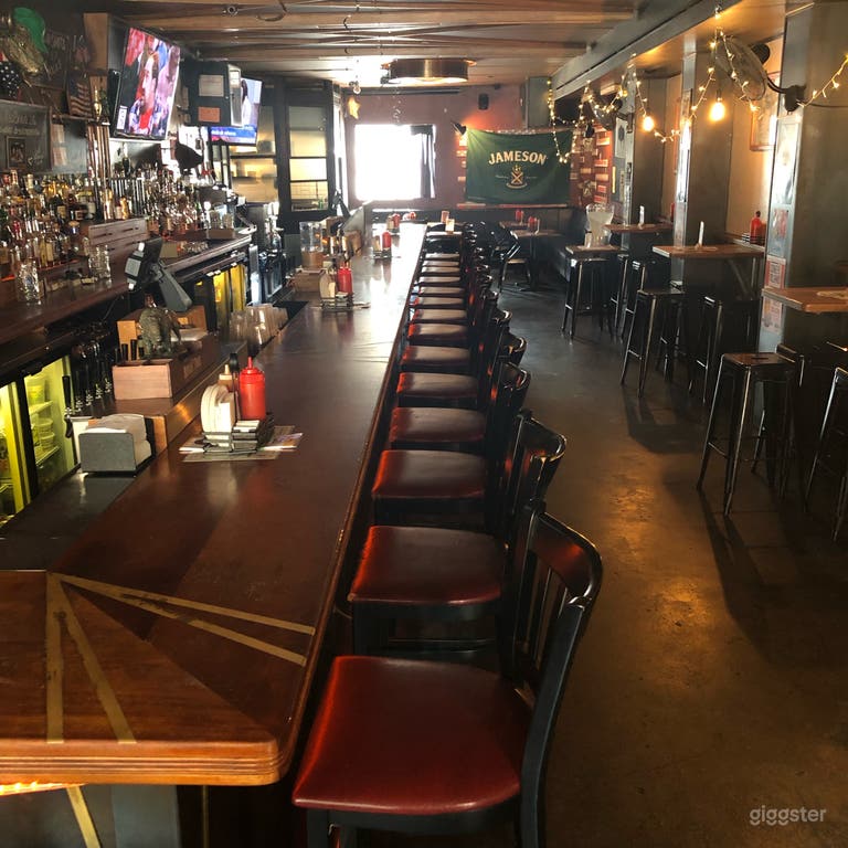  Long shot of our beautiful bar and some of our high top wall tables 