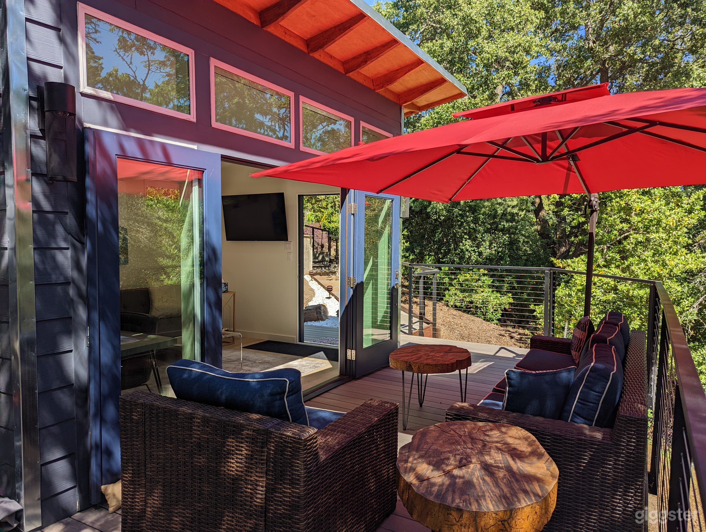 Deck seating - 1 red, 1 grey umbrella