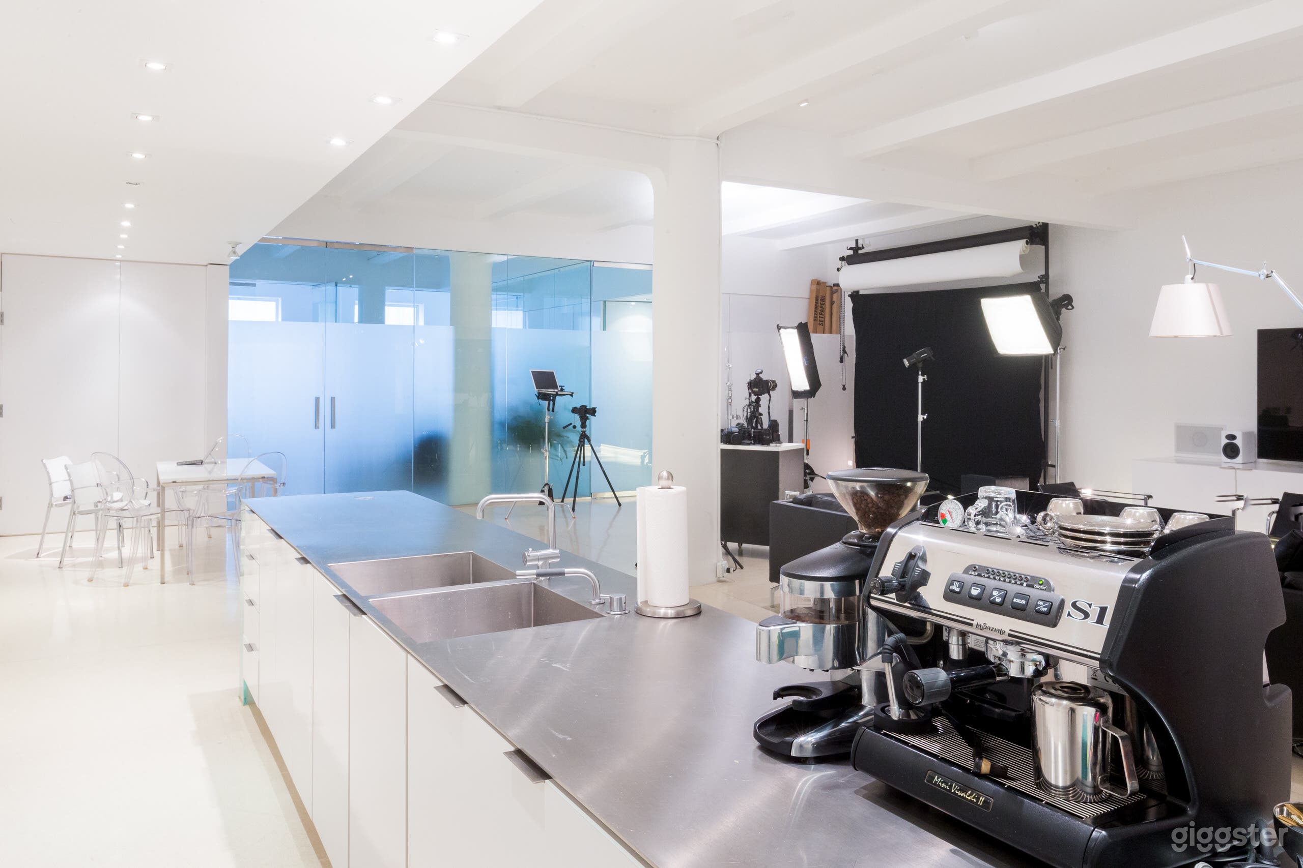 View of the amazing custom 14.5 foot single piece integrated stainless steel countertop and sinks.  La Spaziale espresso machine.  Vola faucets.