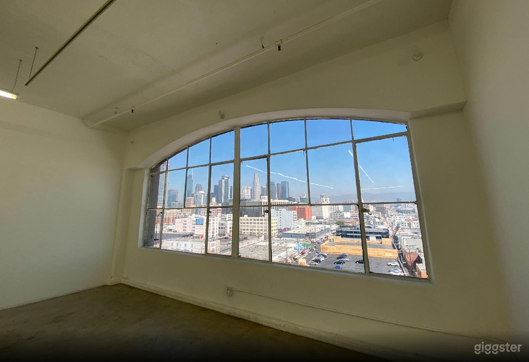 Plenty of natural lighting with a skyline view.