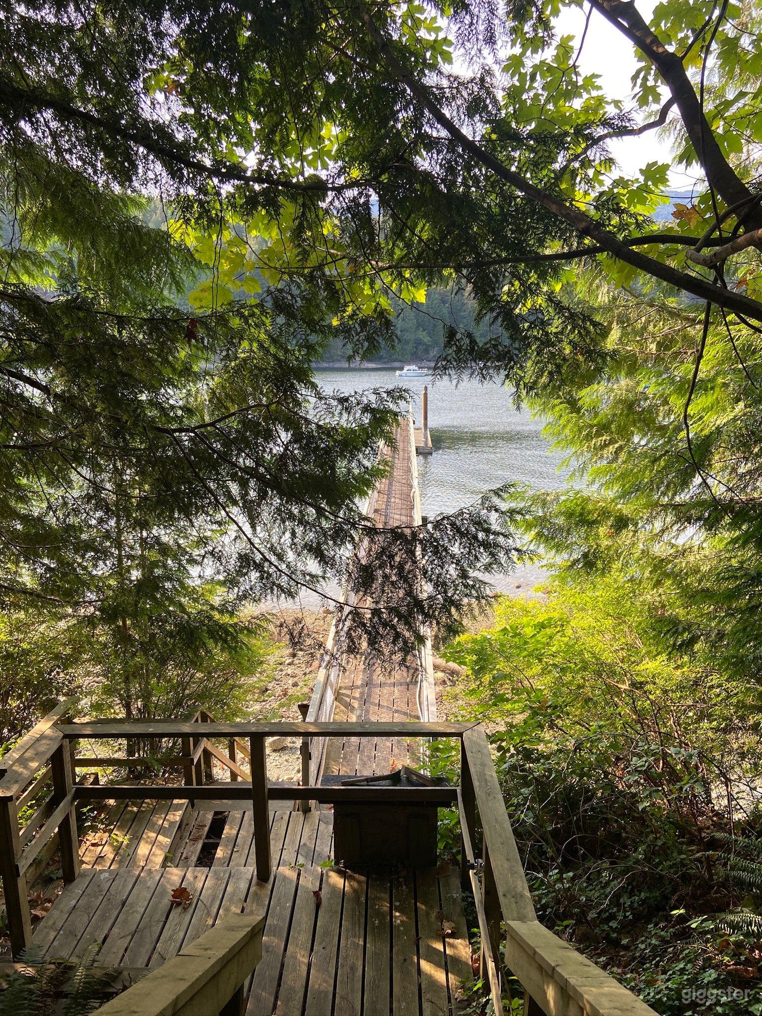 Waterfront View between the Ocean and Mountains Photo 1