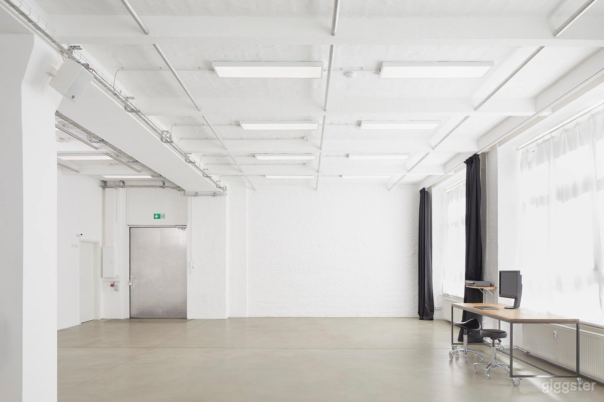 Main room with brick wall