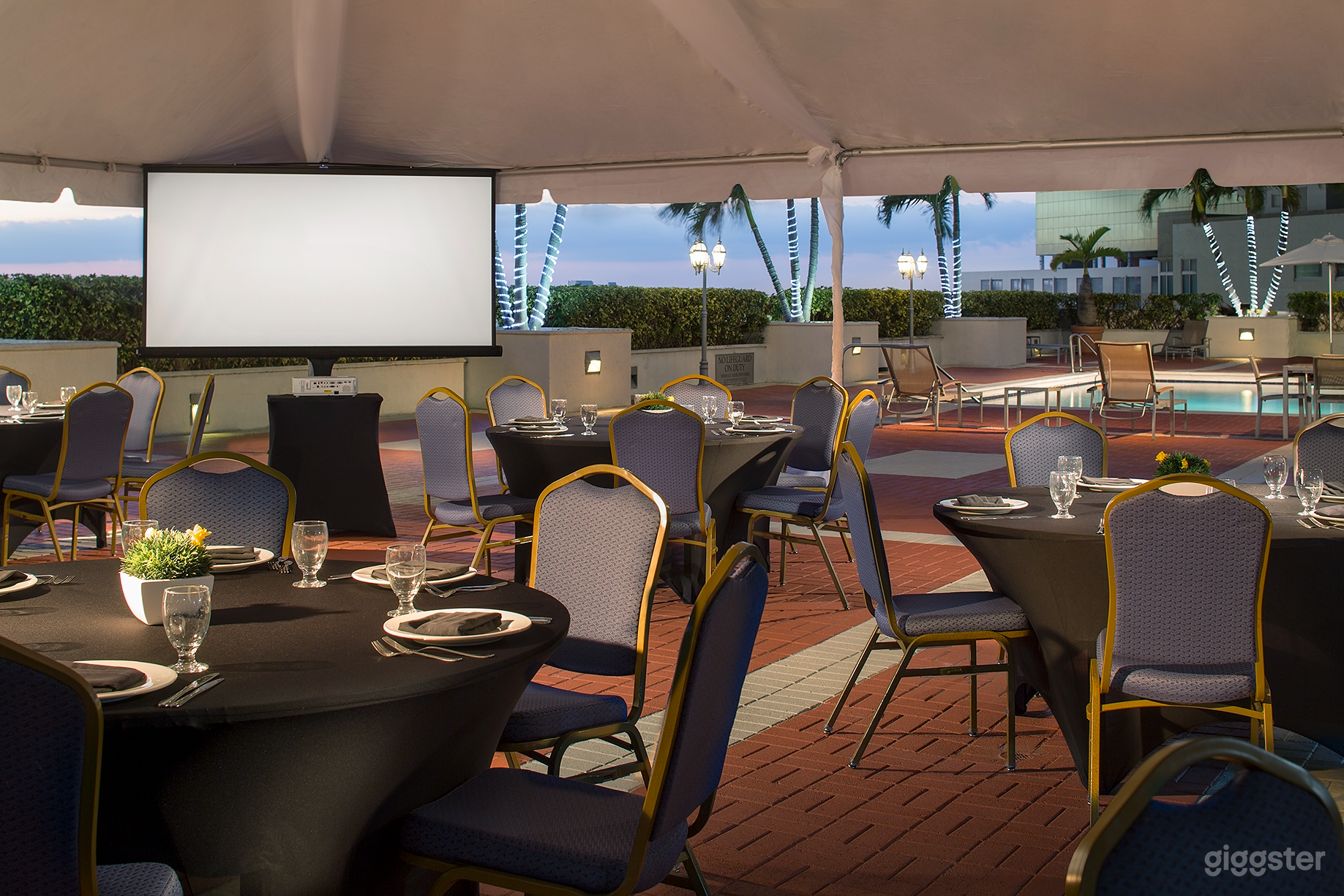 Elegant Poolside Event Terrace with Outdoor Dining Photo 3