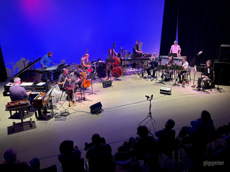  Live music performance with large ensemble including grand piano 