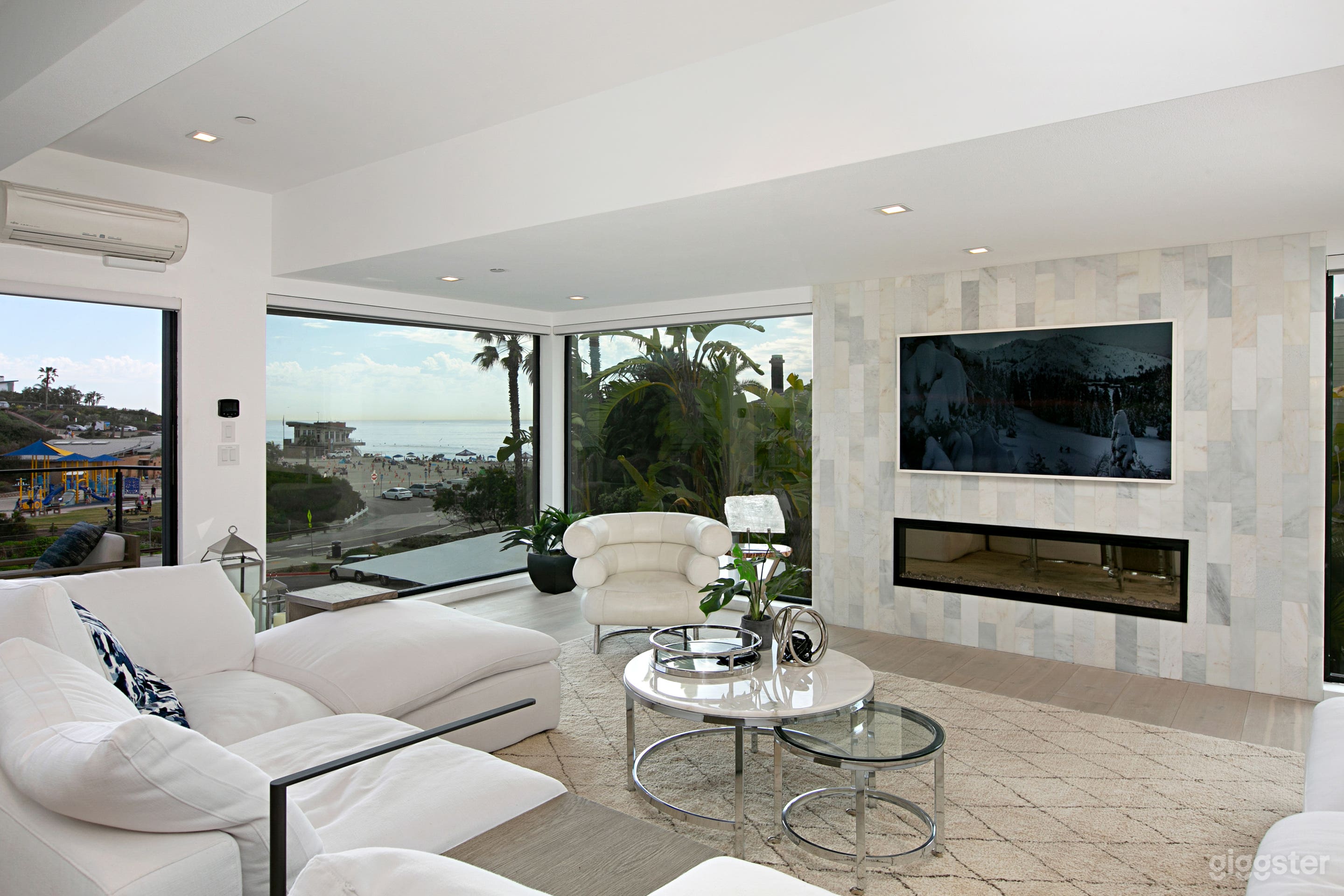  modern living room with fireplace and beach/ocean view