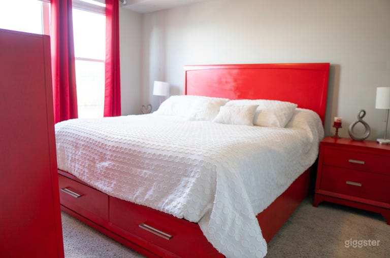  Oversized King bed with unique red decor 