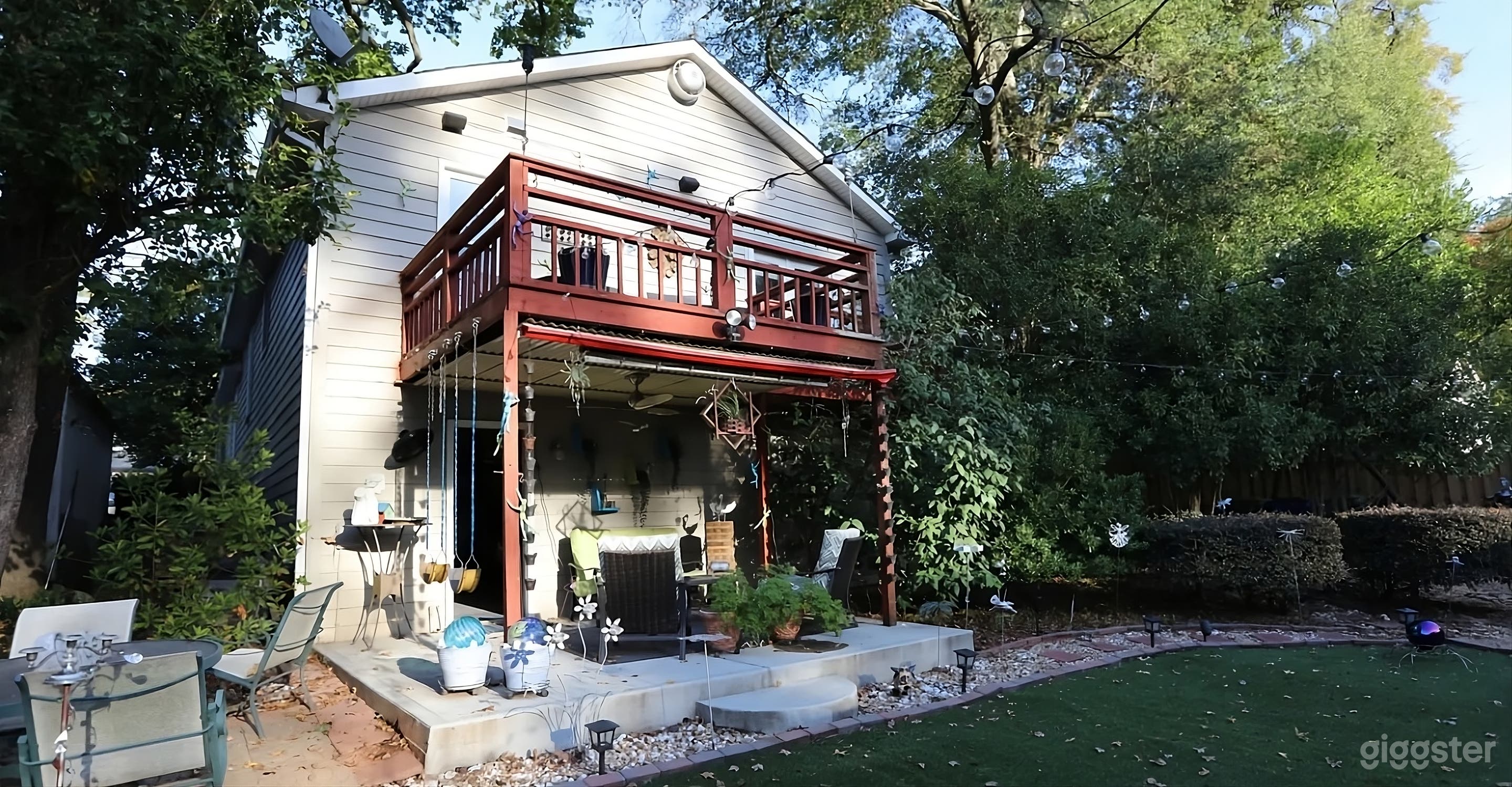Lush Backyard with Covered Seating Photo 3