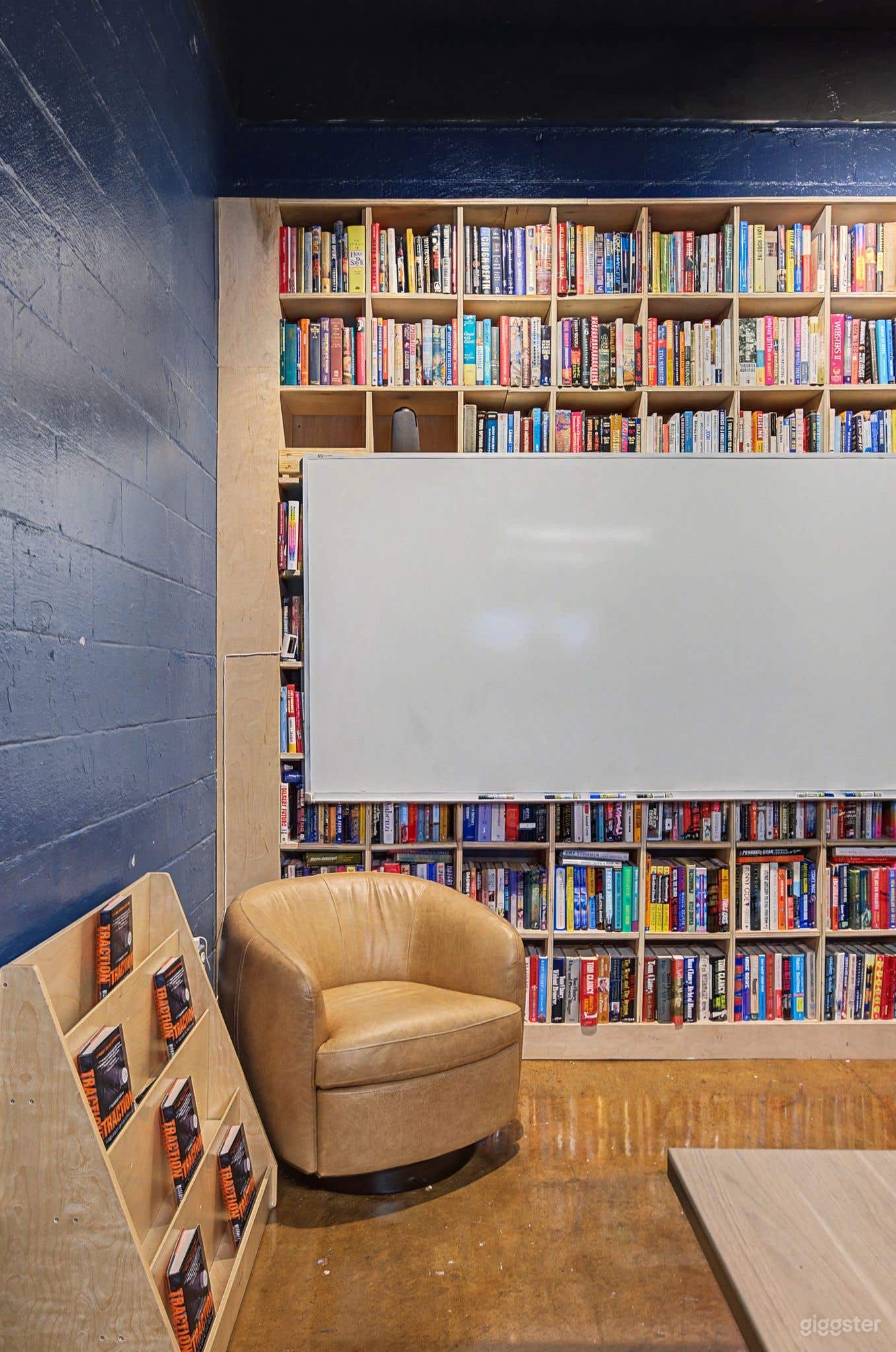 Library-Inspired Conference Room with Wall-to-Wall Books Photo 4