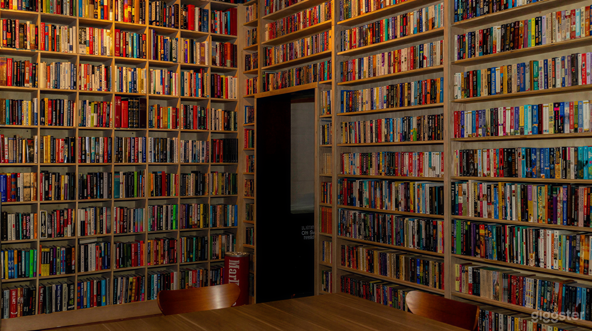 Library-Inspired Conference Room with Wall-to-Wall Books Photo 2