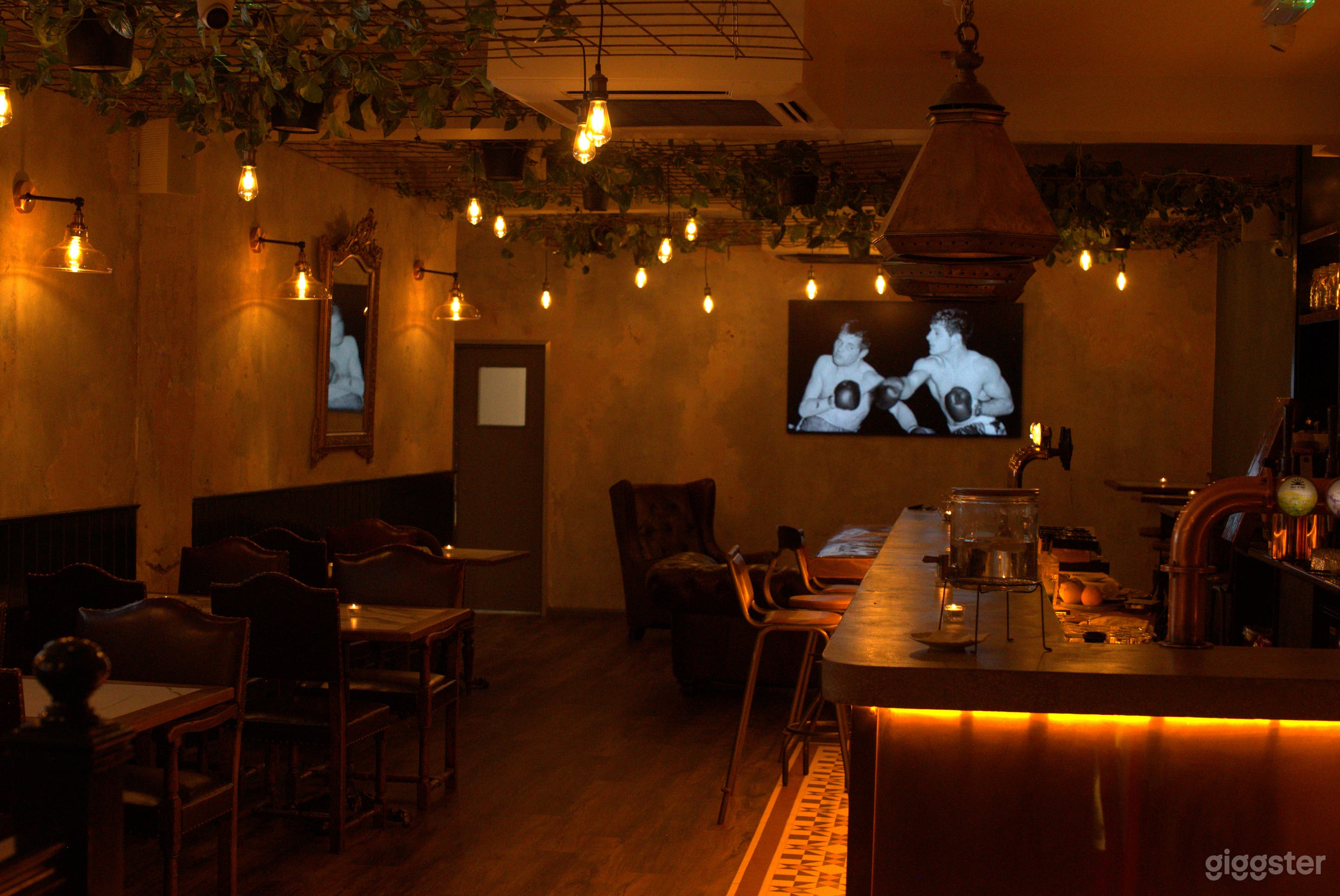 Second Floor Cozy Bar with Cement Looking Walls Photo 3