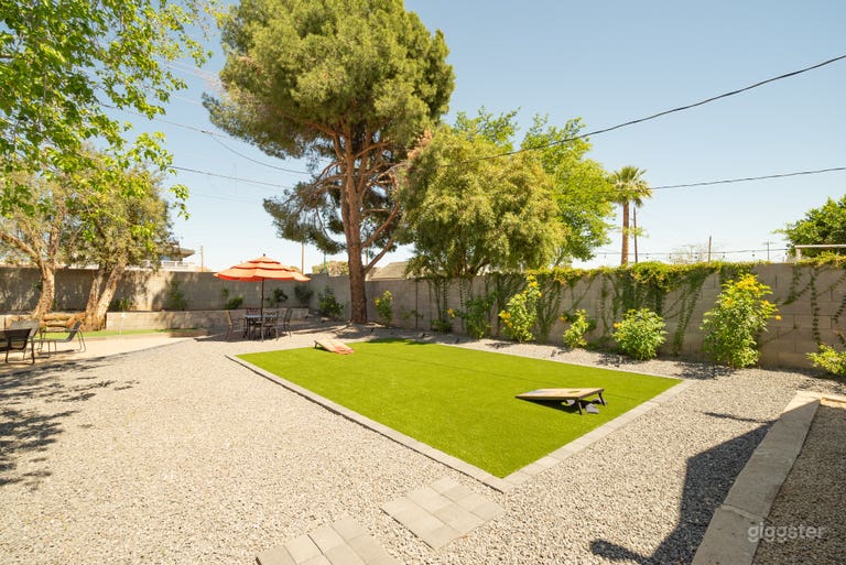  Beautiful backyard with turf, mini golf, BBQ propane grill, outdoor dining and seating. 