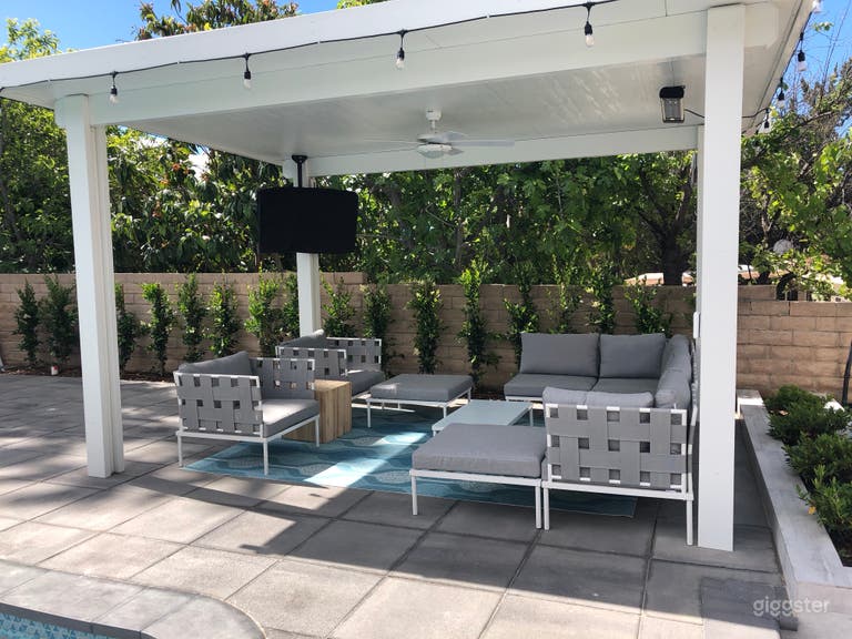  Covered pergola with tv and outdoor seating 