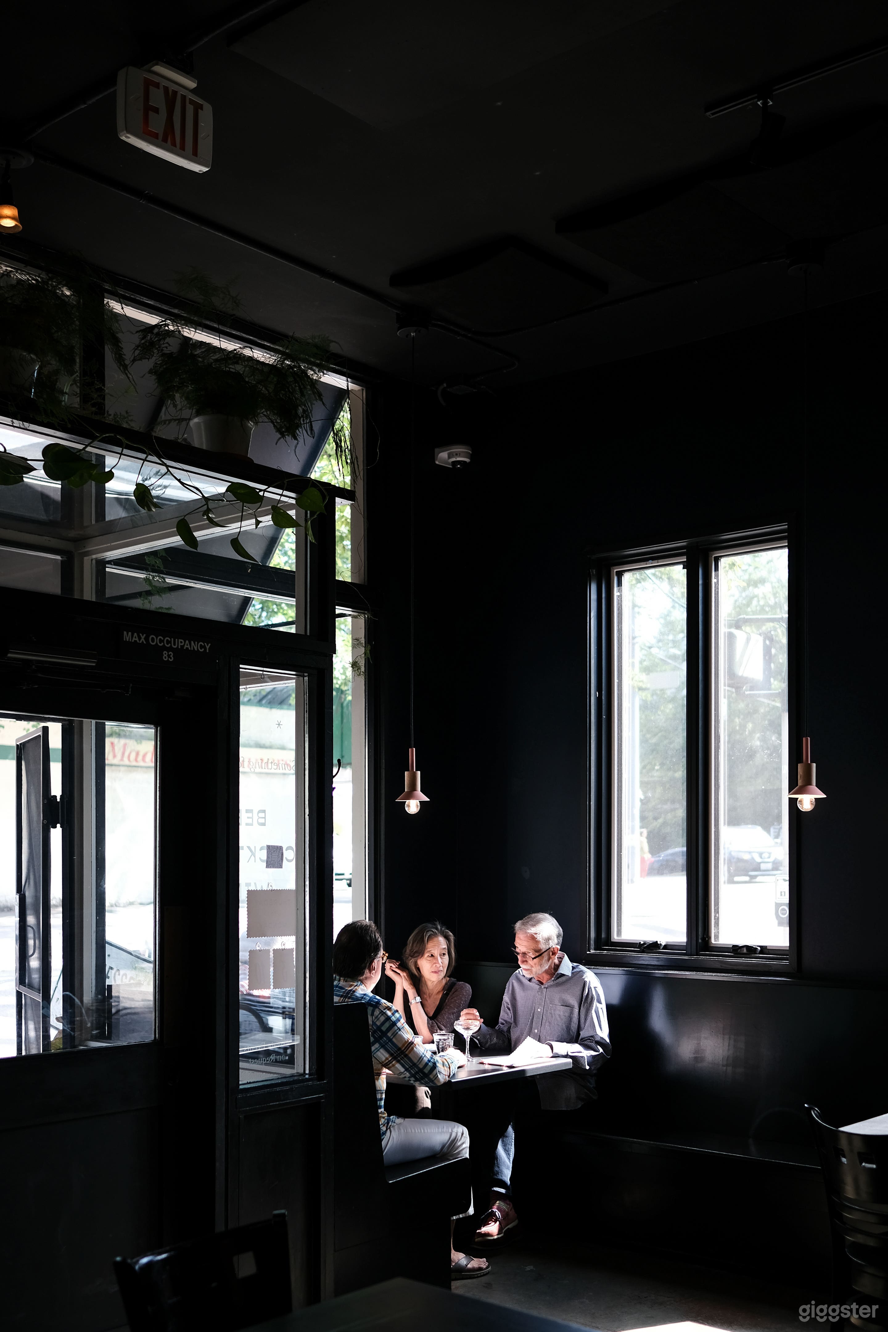 Booths in both the back and the front of the restaurant are dark and cozy with intimate lighting.