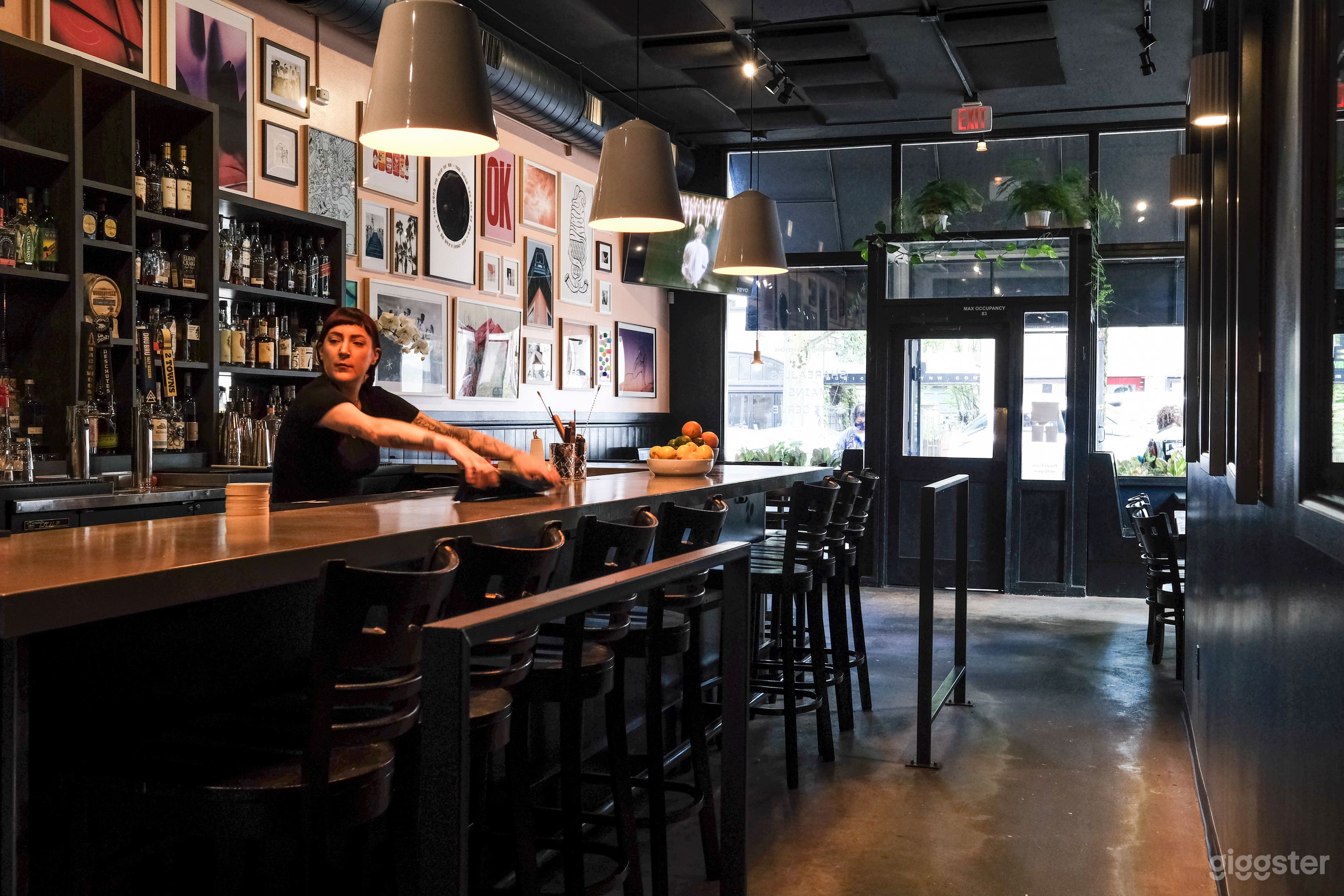 View from the patio entrance of the front door and  seating area, and the bar.
