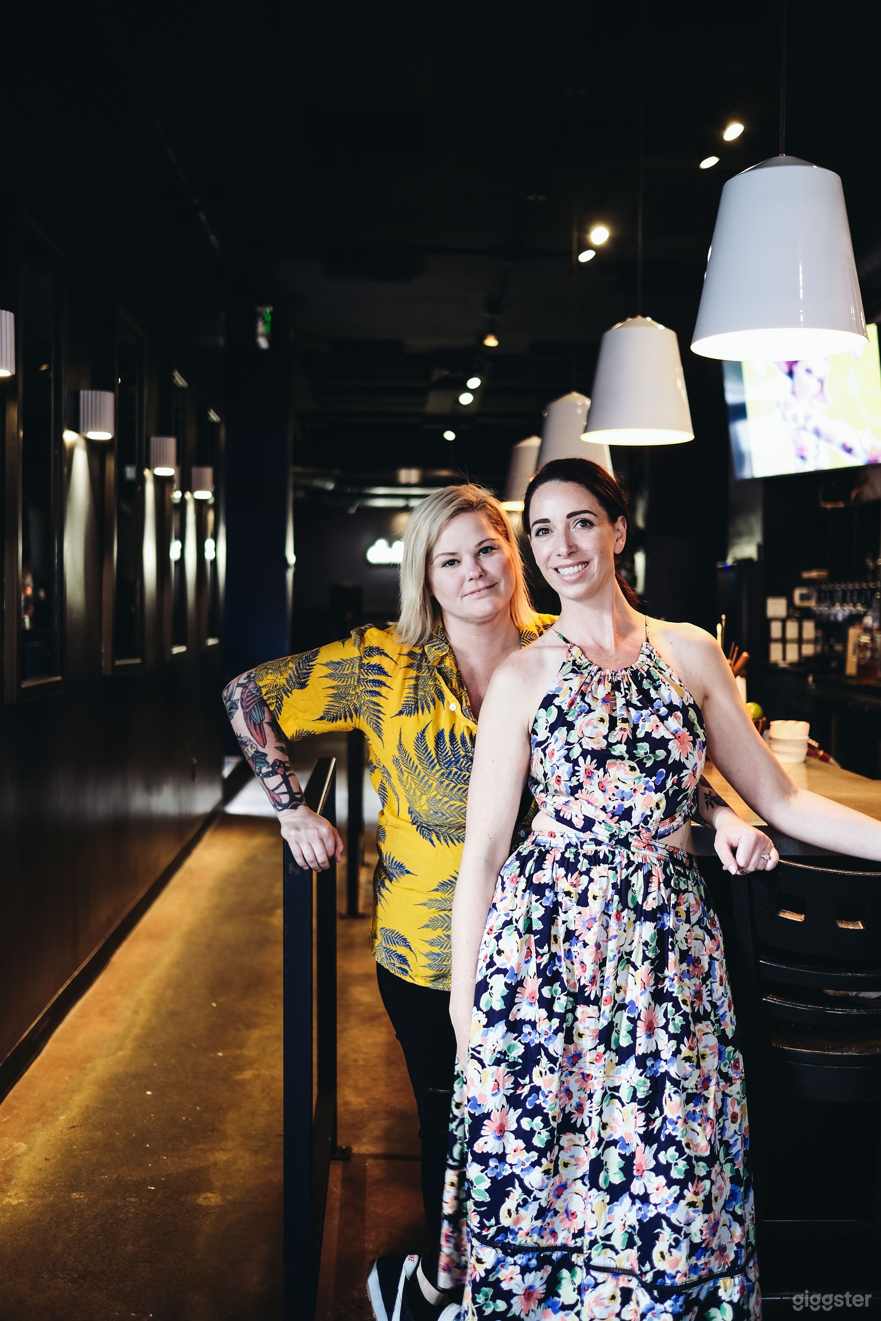 View from the front door through the bar and a sneak peek of the neon in the back that says, "don't be a stranger".
