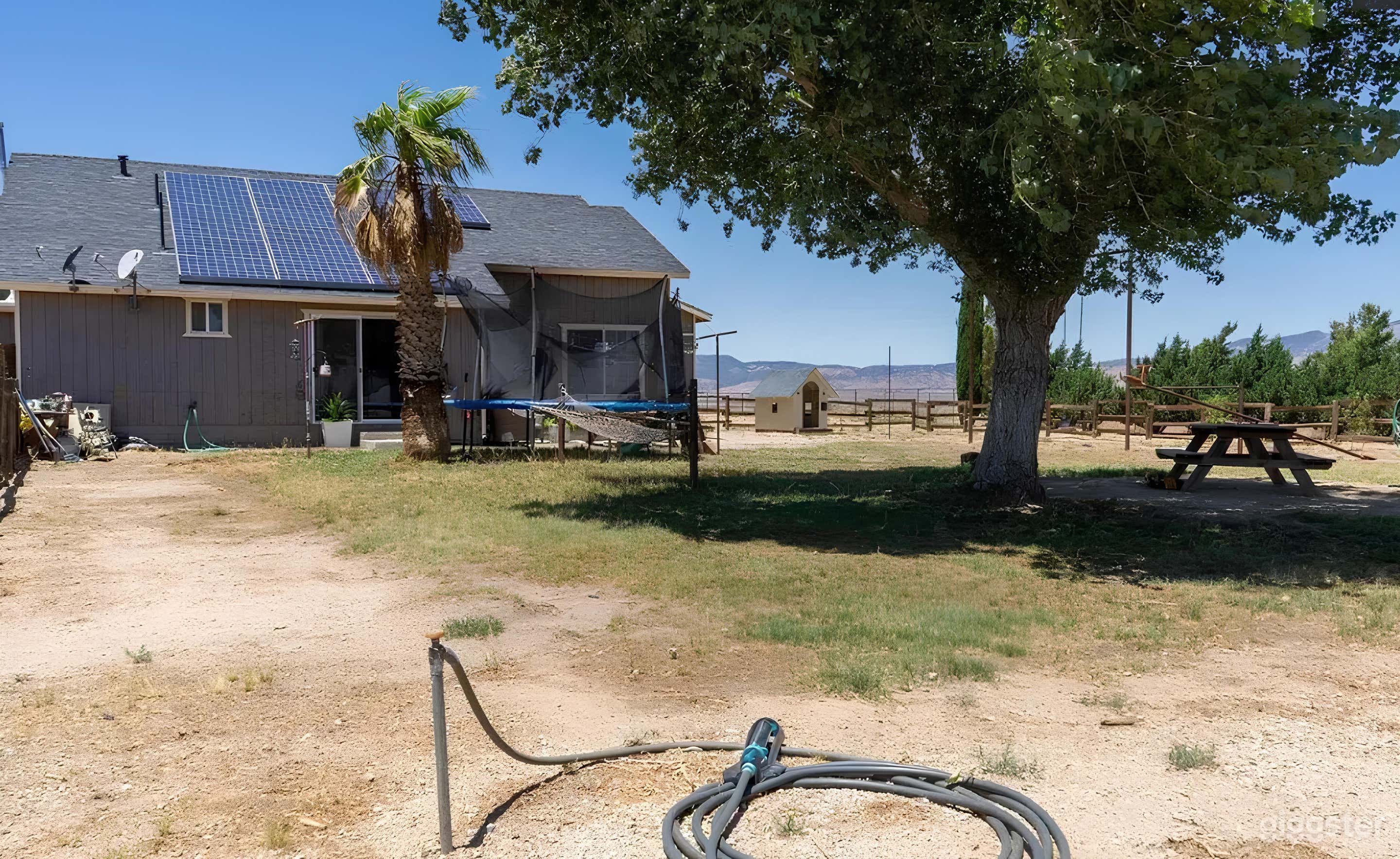 Rural Backyard with Mountain Views Photo 1