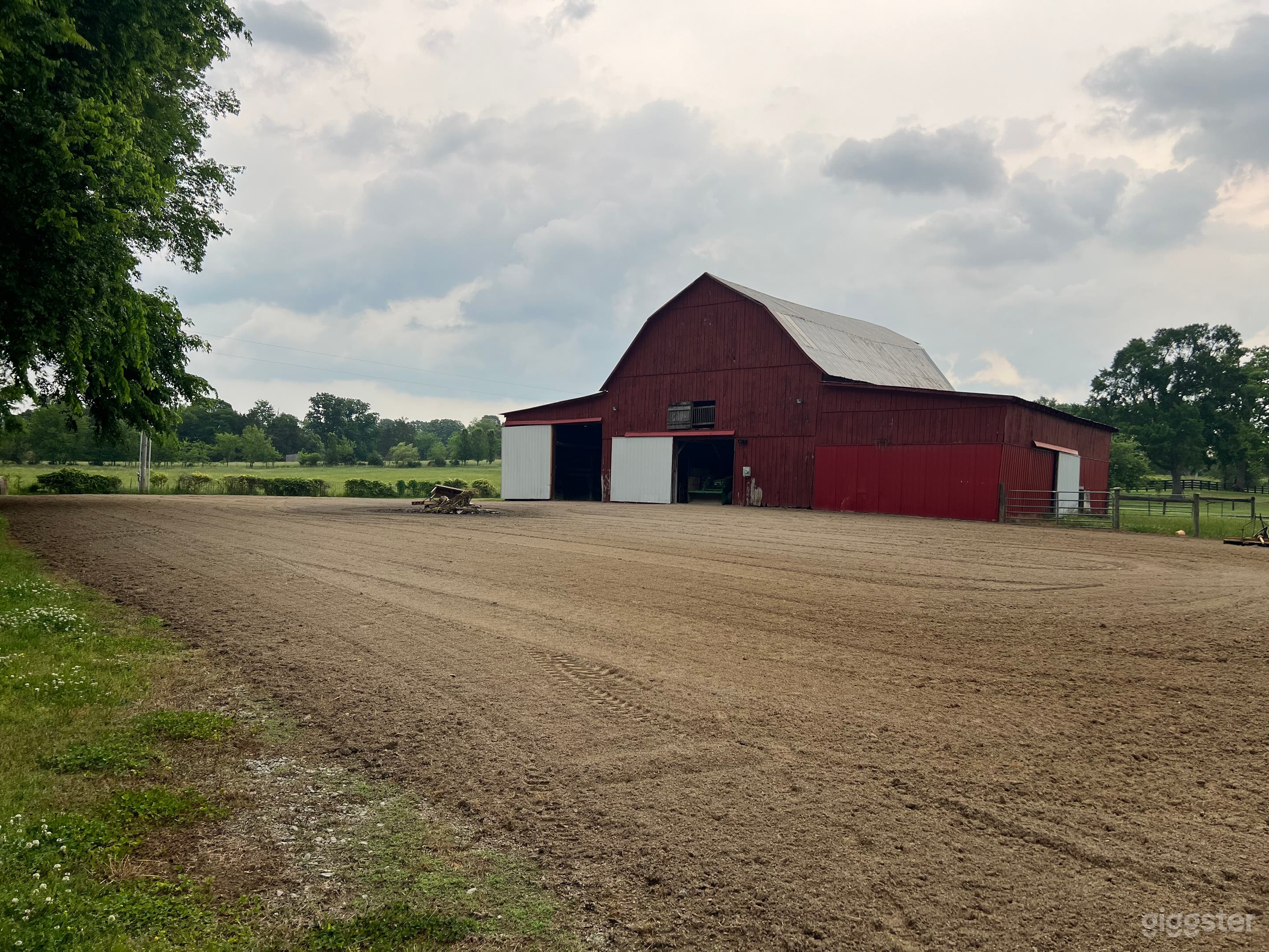 Large gravel area behind the barn with large fire pit.  This area has also been used for staging and parking.