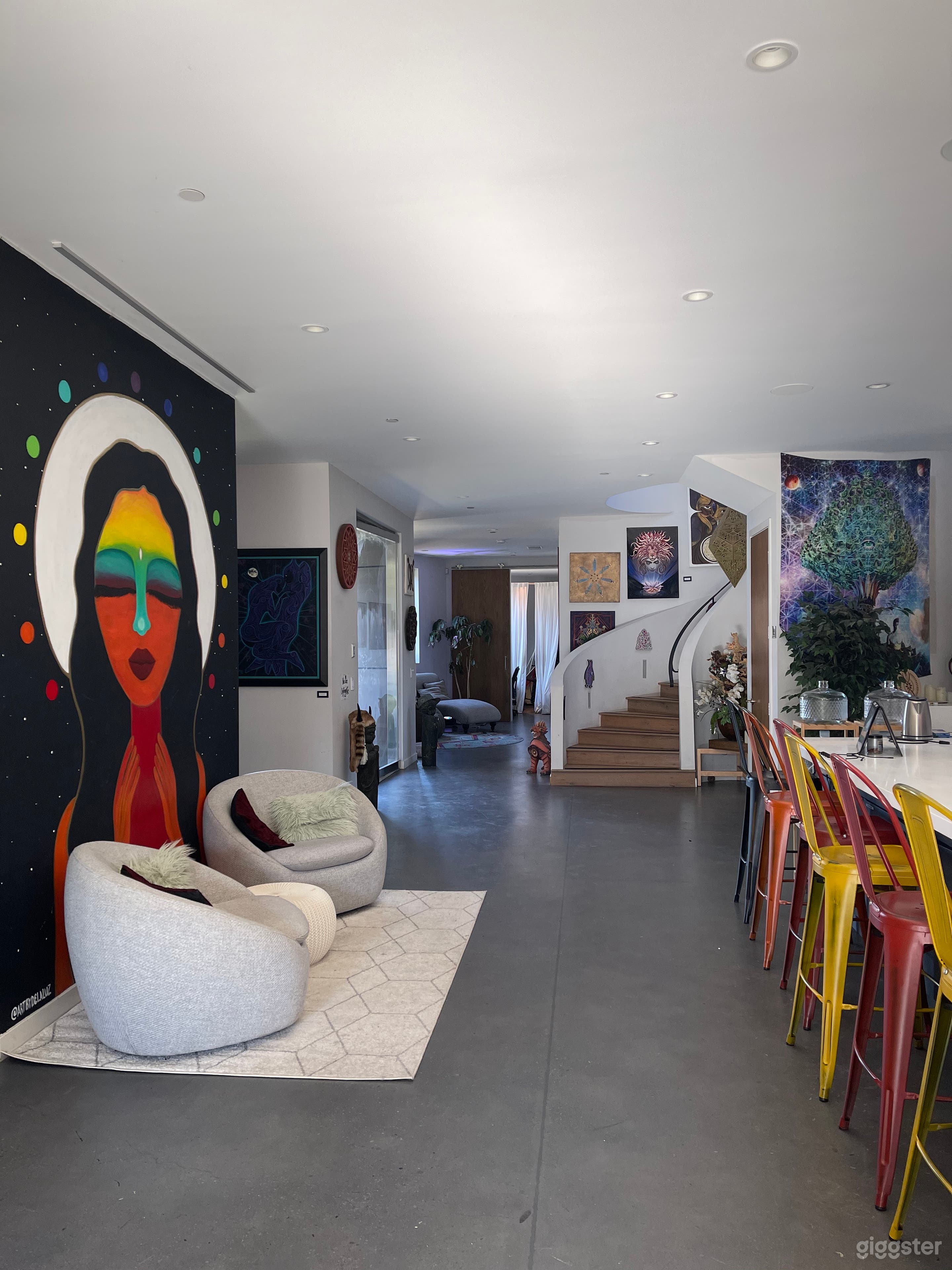Our unique home is filled with original visionary art, including two wall murals. Wall to ceiling windows and glass doors allows lots of sunlight during the day