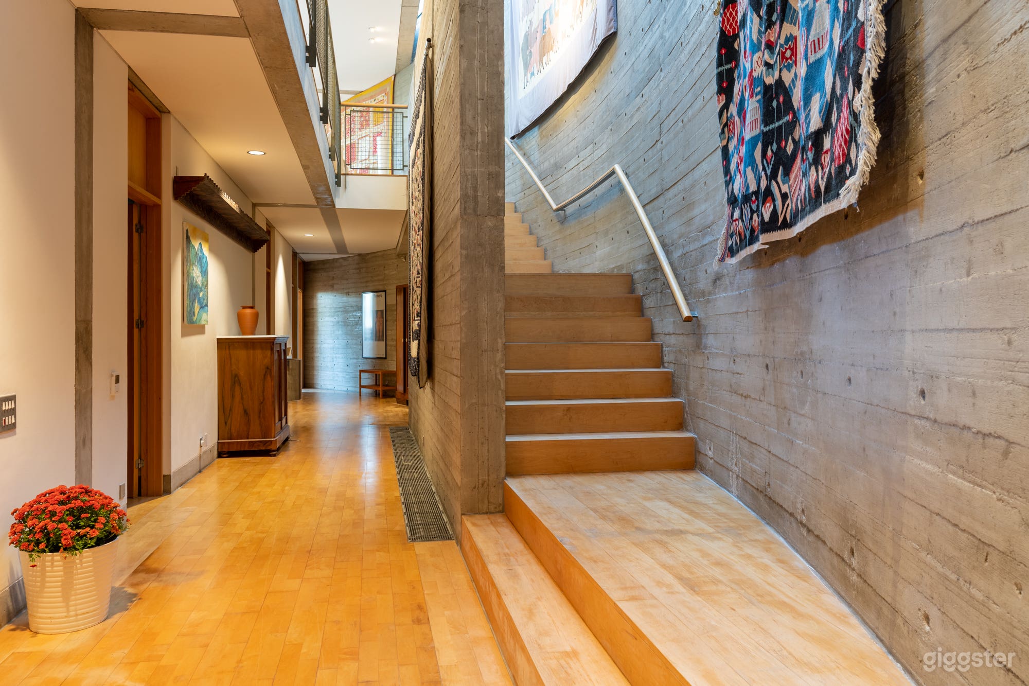 Main entrance with stairs and skylight leading to first floor