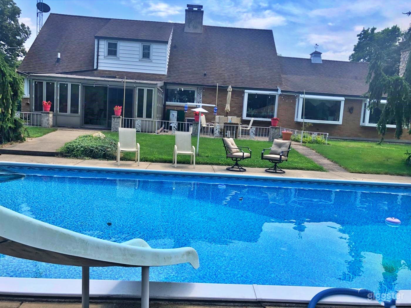 Refreshing Pool with a Slide Photo 3