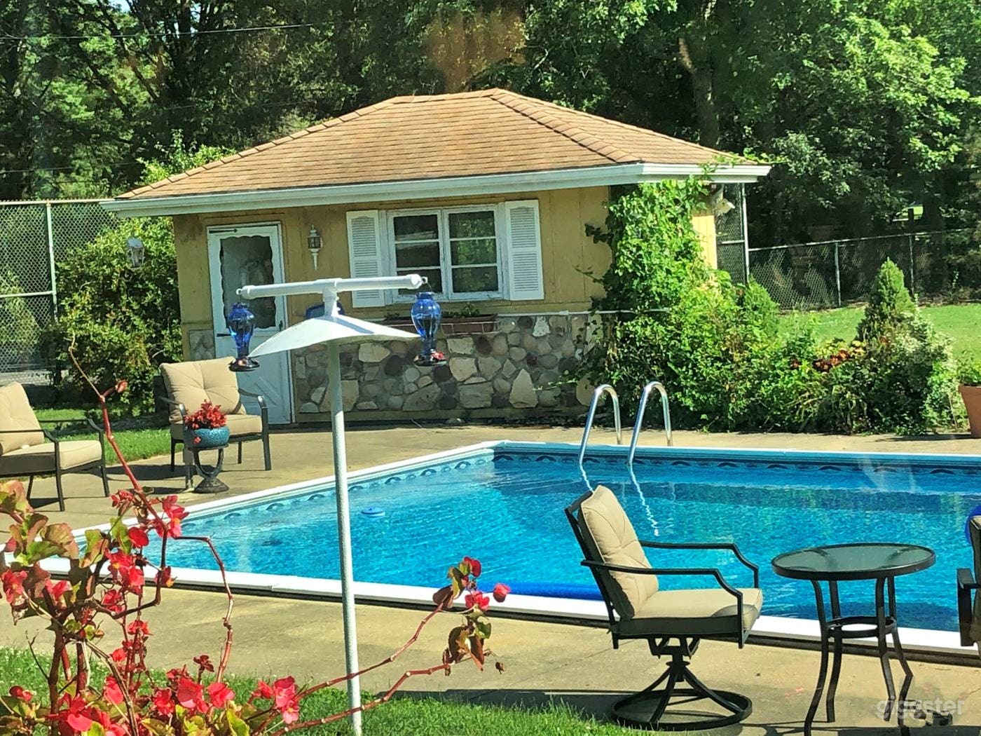 Refreshing Pool with a Slide Photo 2