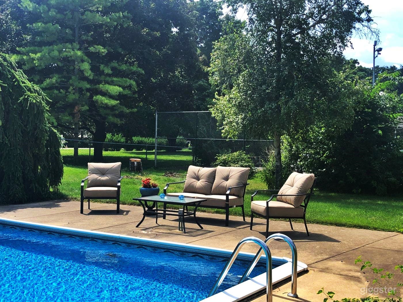 Refreshing Pool with a Slide Photo 4