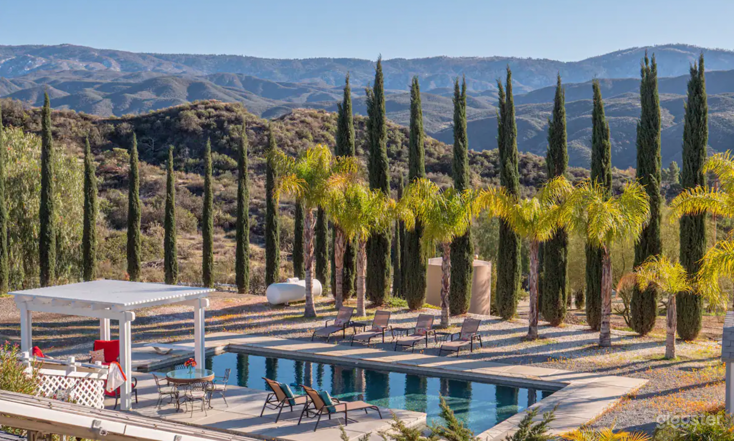 Embrace tranquility where azure waters meet majestic mountains; a paradise touched by the whispers of palm and cypress trees. This isn't just a saltwater pool, it's a serene escape into nature's luxury lounge.

