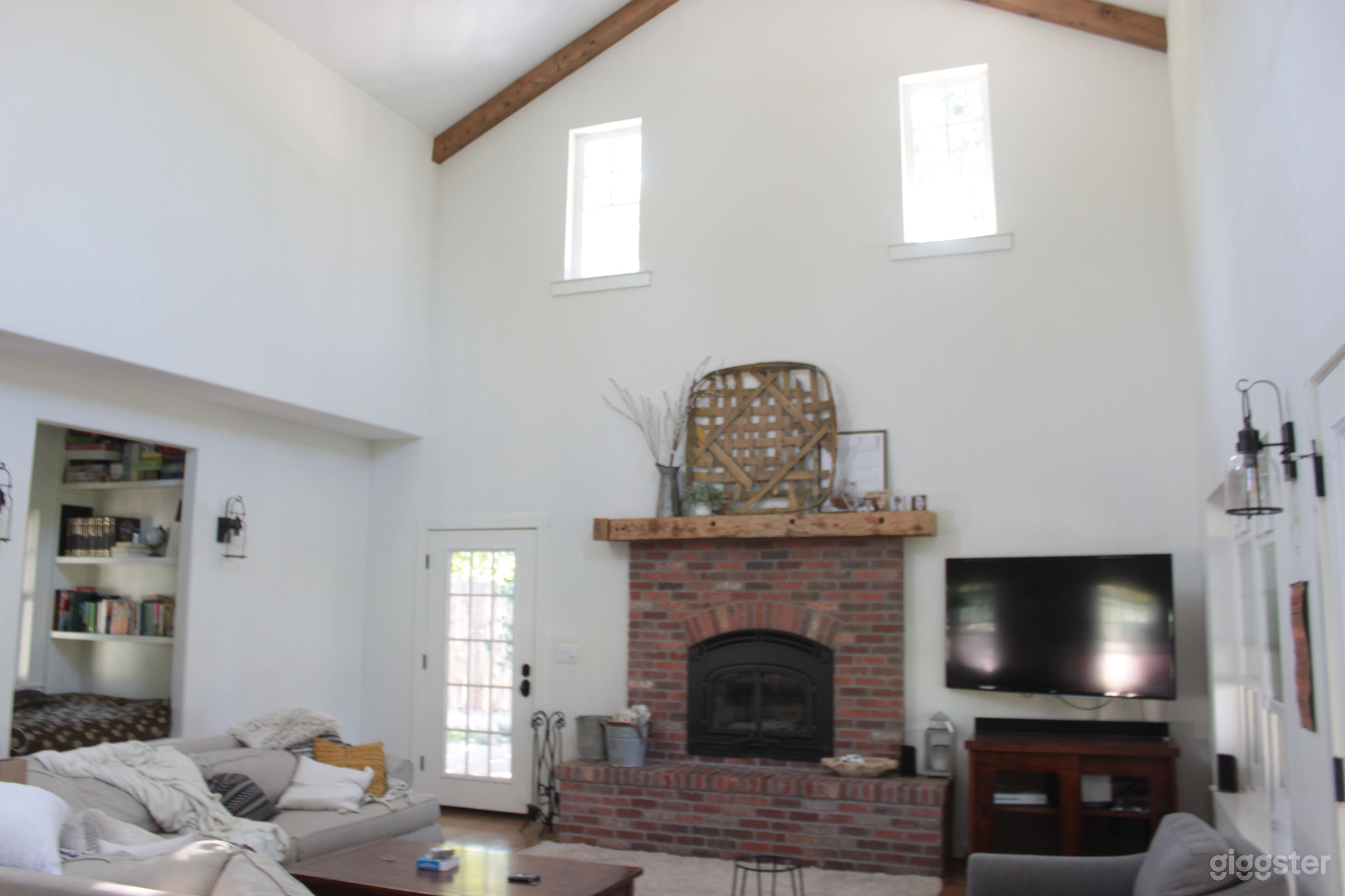 Living area with 26' ceilings and great natural light