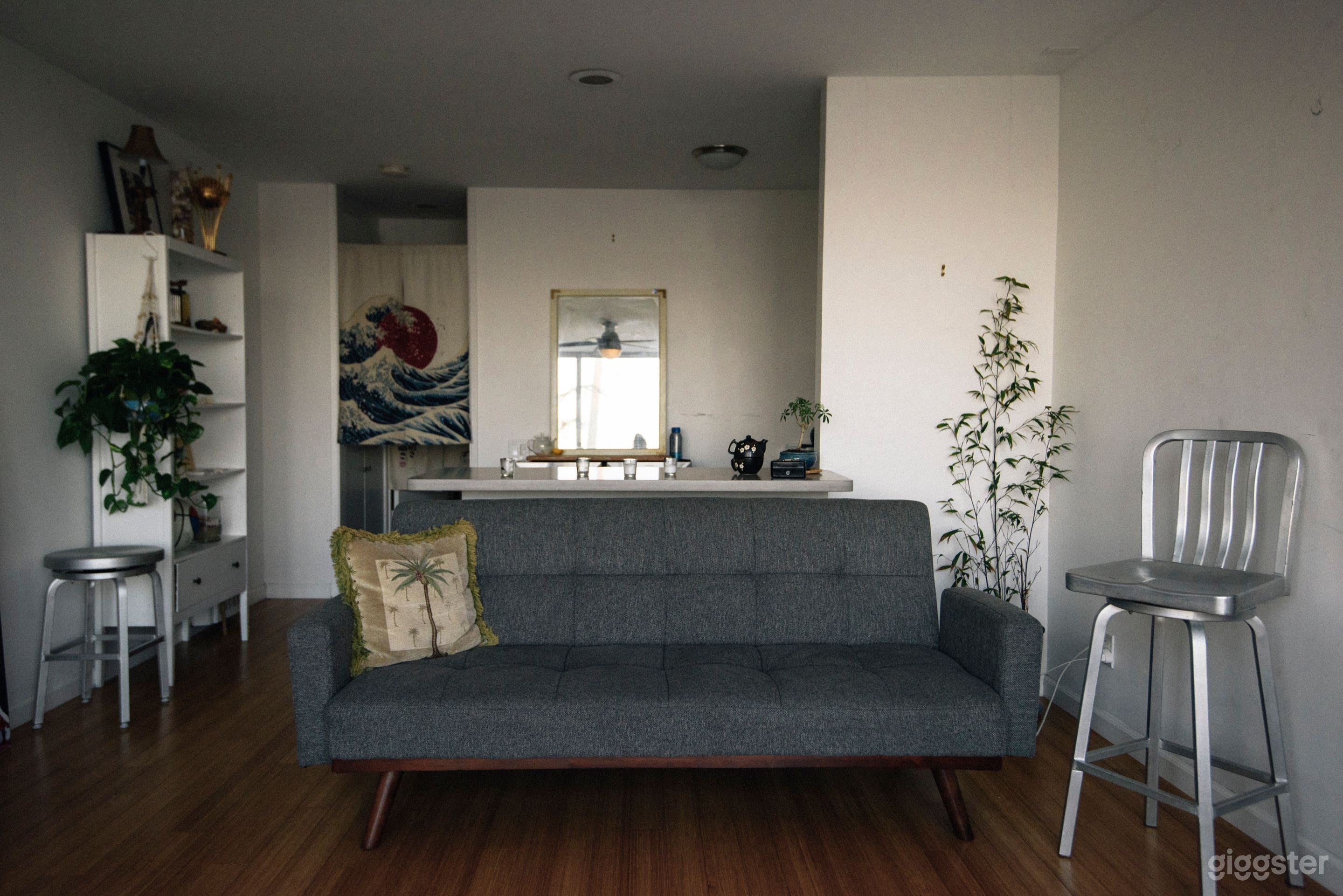 The art comes down, the couch can come out for an editing bay. 