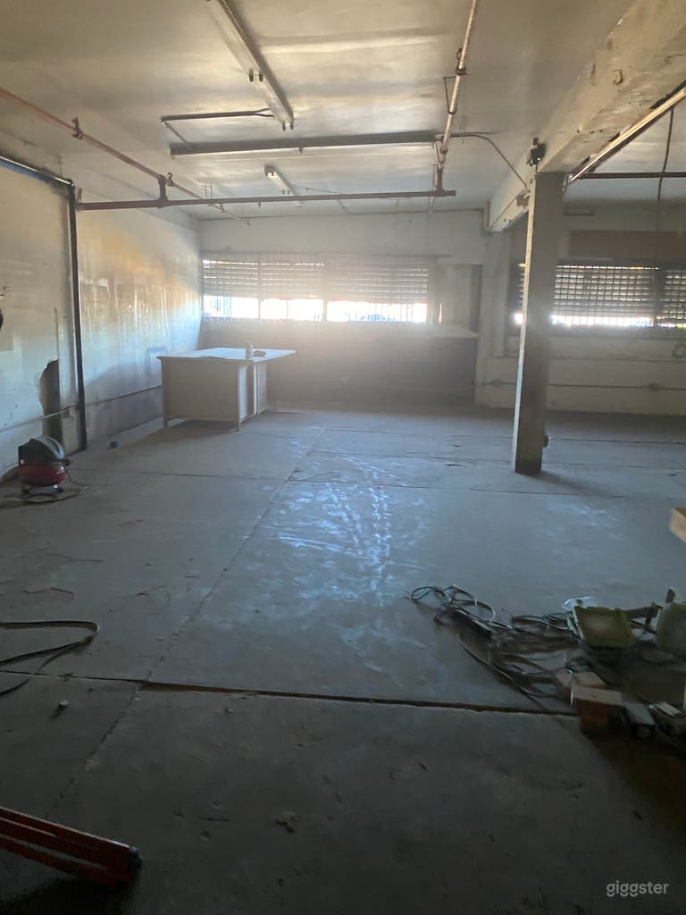  7000 sq.ft. raw space, 30' high ceilings. Skyjack at request 