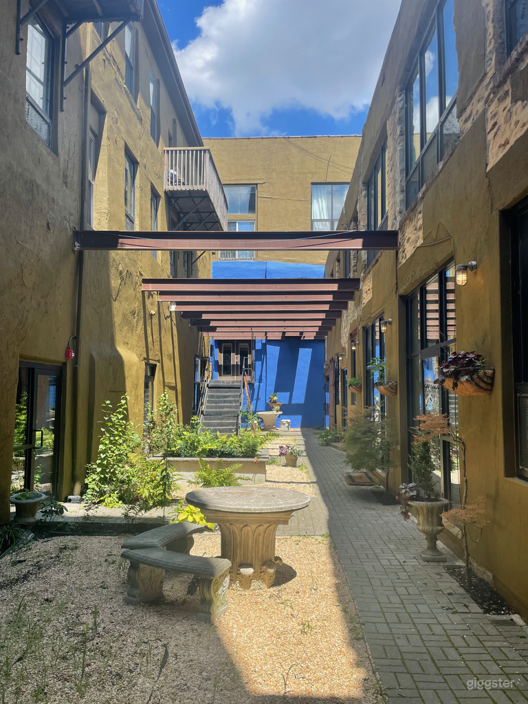  the enclosed courtyard directly outside the door 